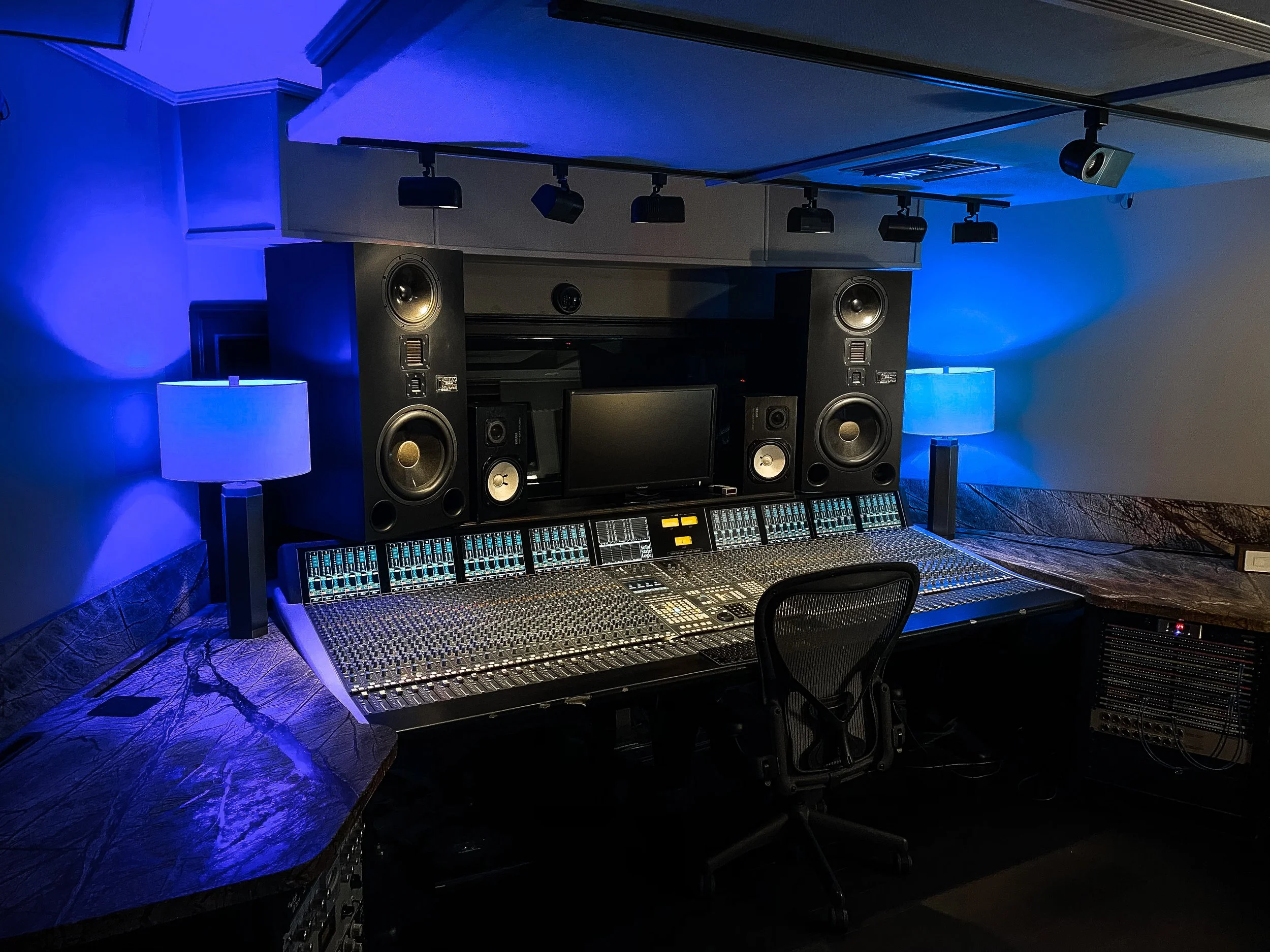 The last picture of the control room at Vanquish Studios before some major remodeling happened. This photo features our Solid State Logic Duality, our Adam S5VA Monitors, and Yamaha Ns-10 monitors. At Vanquish Studios we use Philip Hue LED lights to 