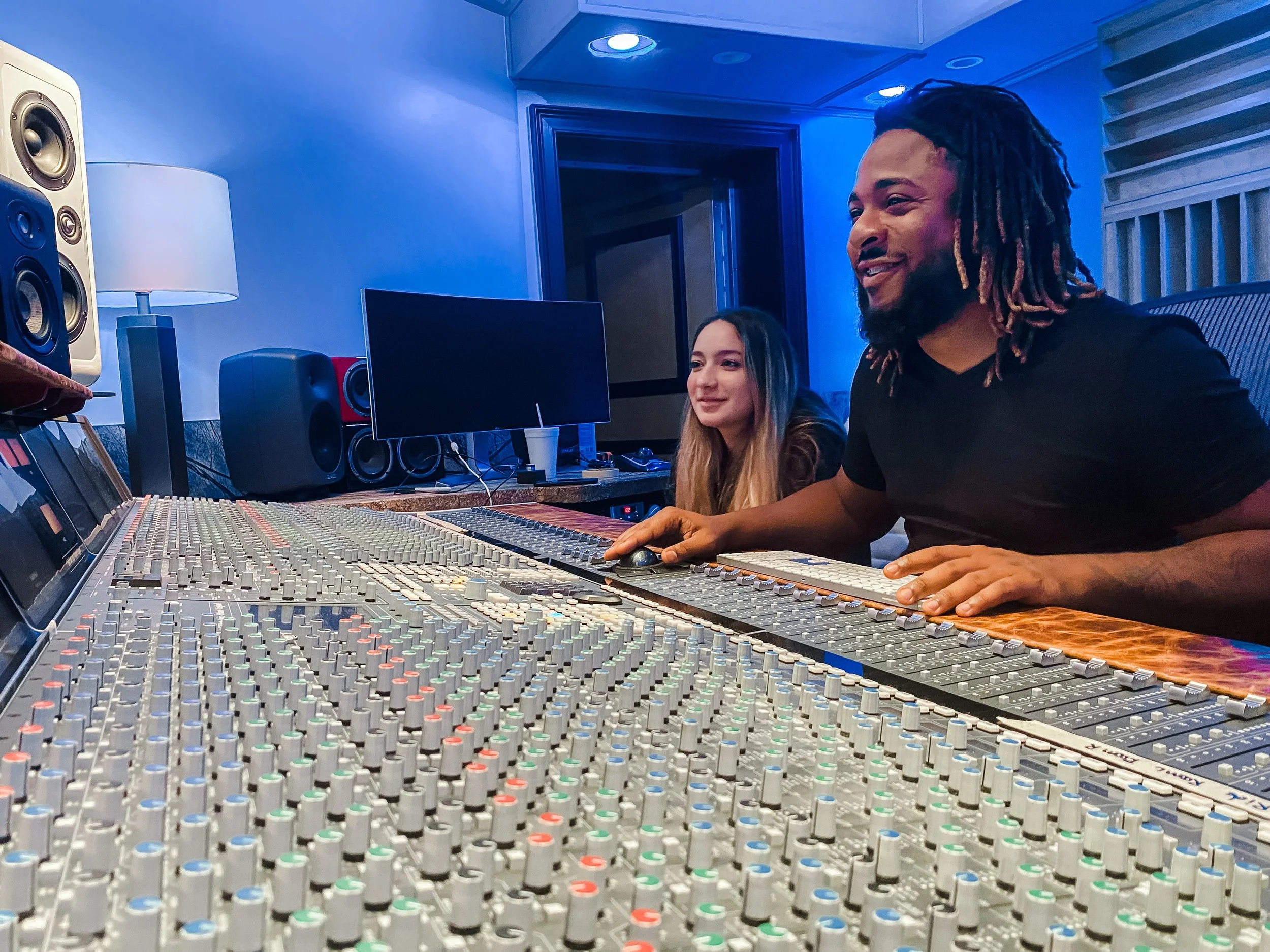 Terrence "Tracksion" Rolle with an up and coming artist working on her original music at Vanquish Studios on the SSL Duality. 
