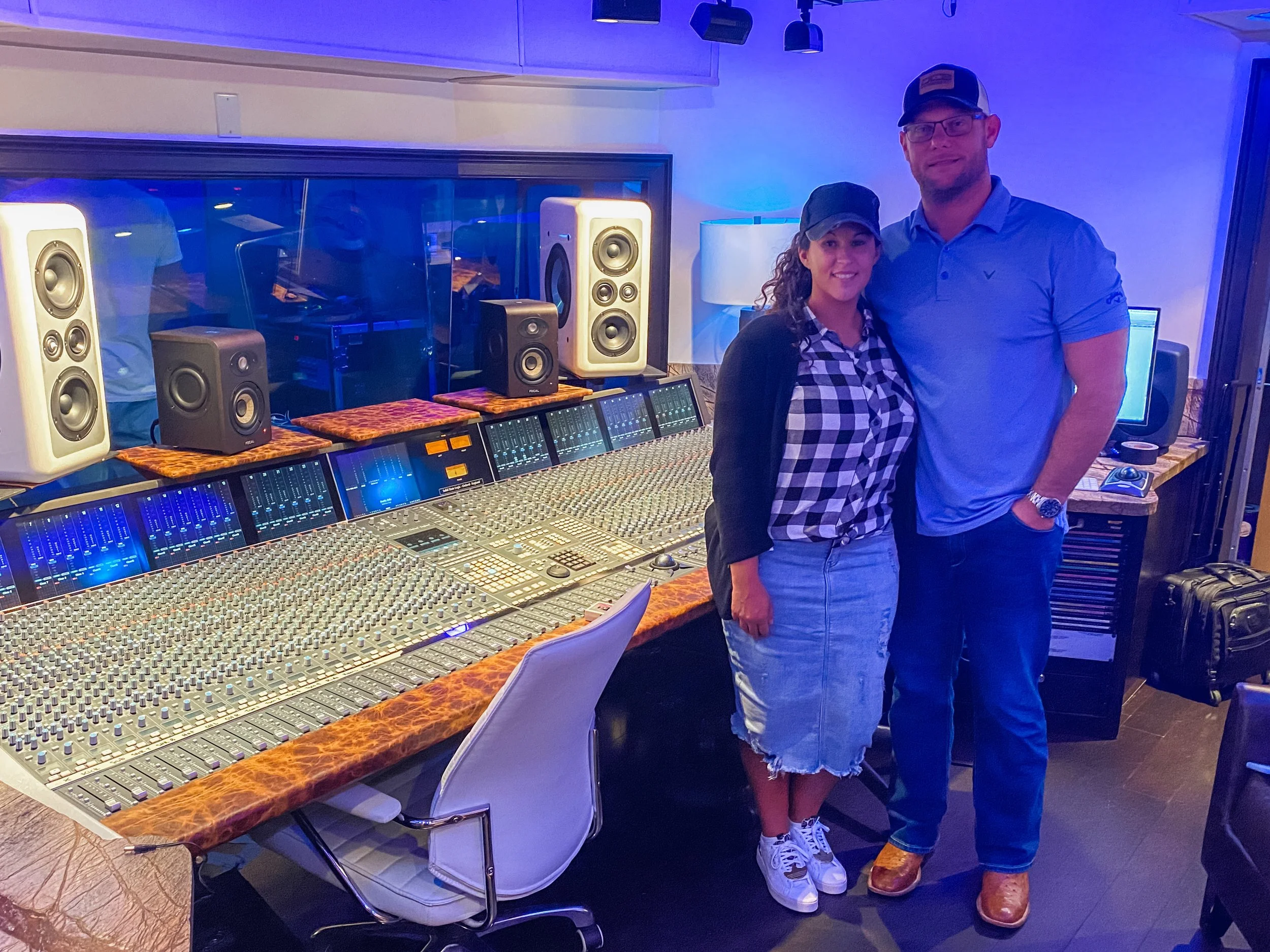 Tera Loftin working at Vanquish Studios. Tera and her husband traveled from Texas to work at Vanquish. Pictured is the SSL Duality and Barefoot Sound MM26 Monitors. 