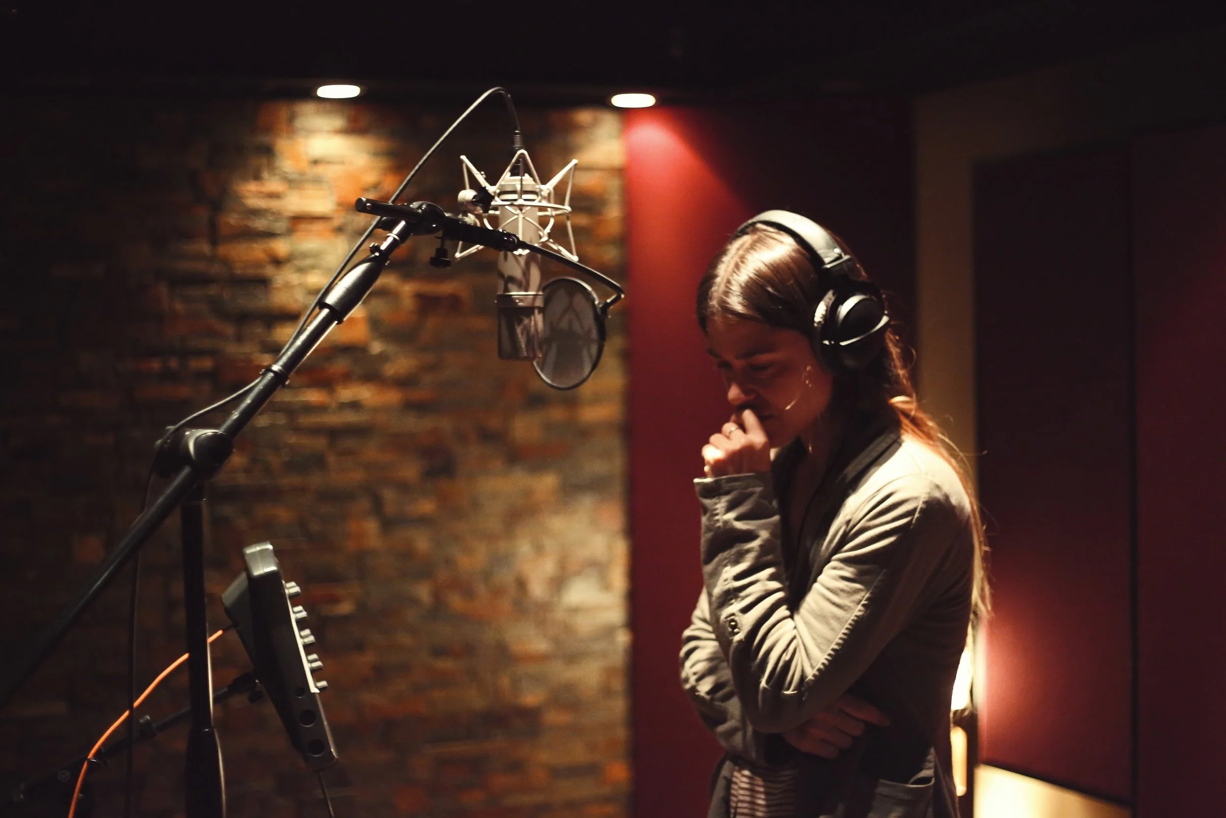 Recording artist in-between vocal takes at Vanquish Studios. 