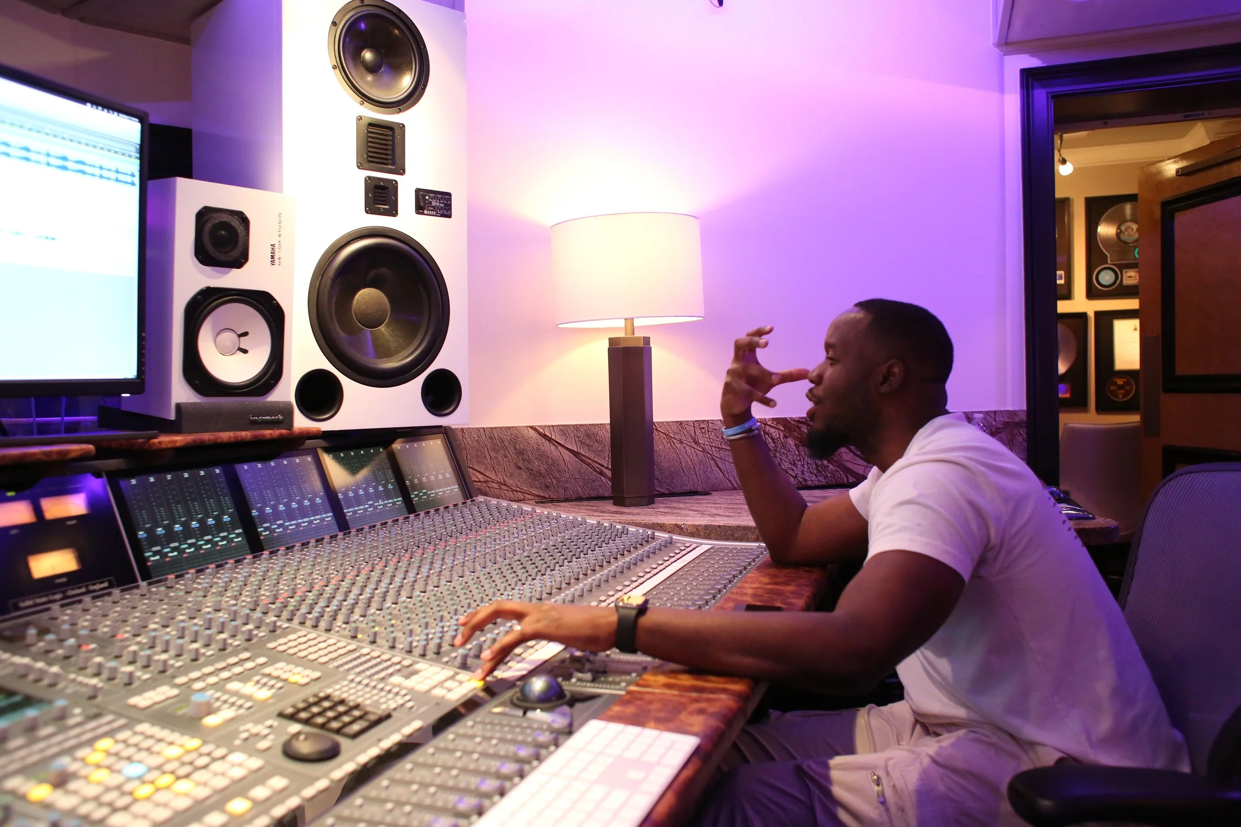 Darnell producing his artists at Vanquish Studios, working on the Solid State Logic Duality. 