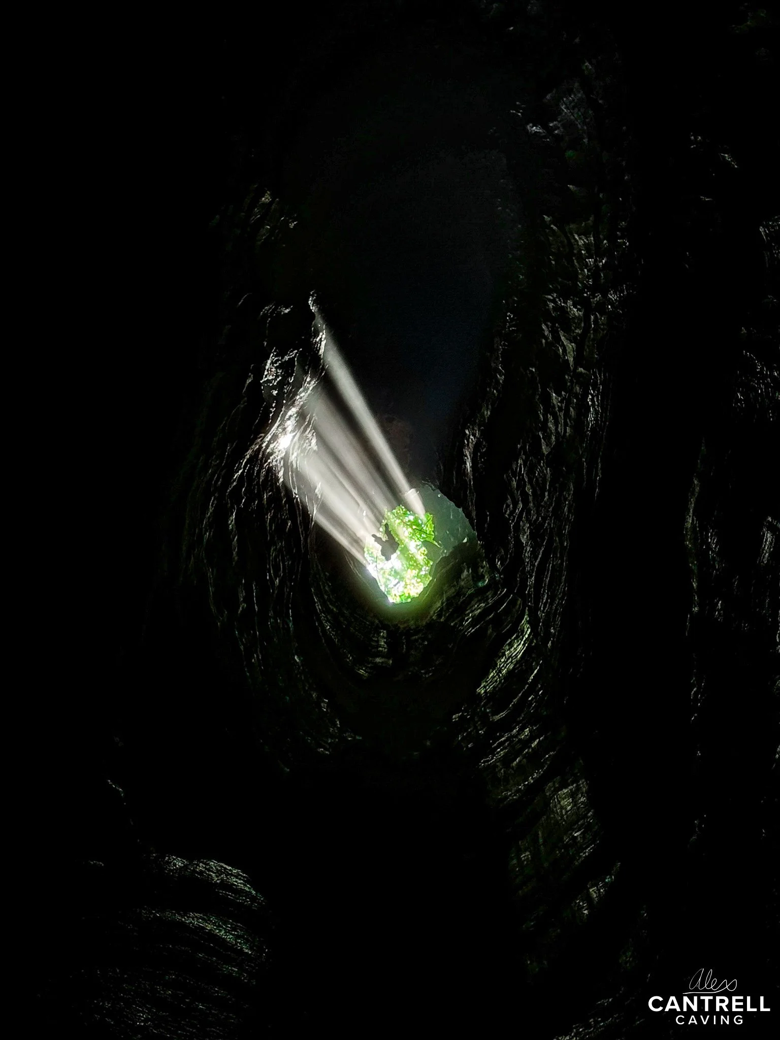 Cave with sunlight streaming through opening
