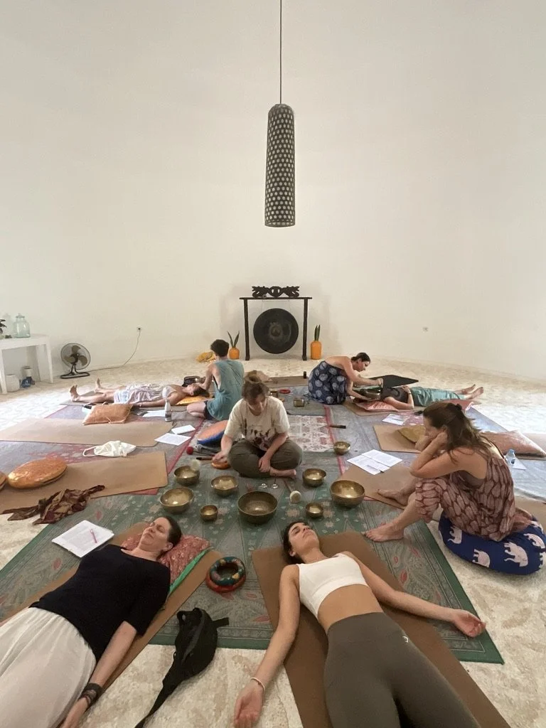 Sound Healing session at SKY Yoga and Meditation in Bali using Tibetan singing bowls to guide deep relaxation, emotional balance, and inner harmony through sound vibration and intention setting.