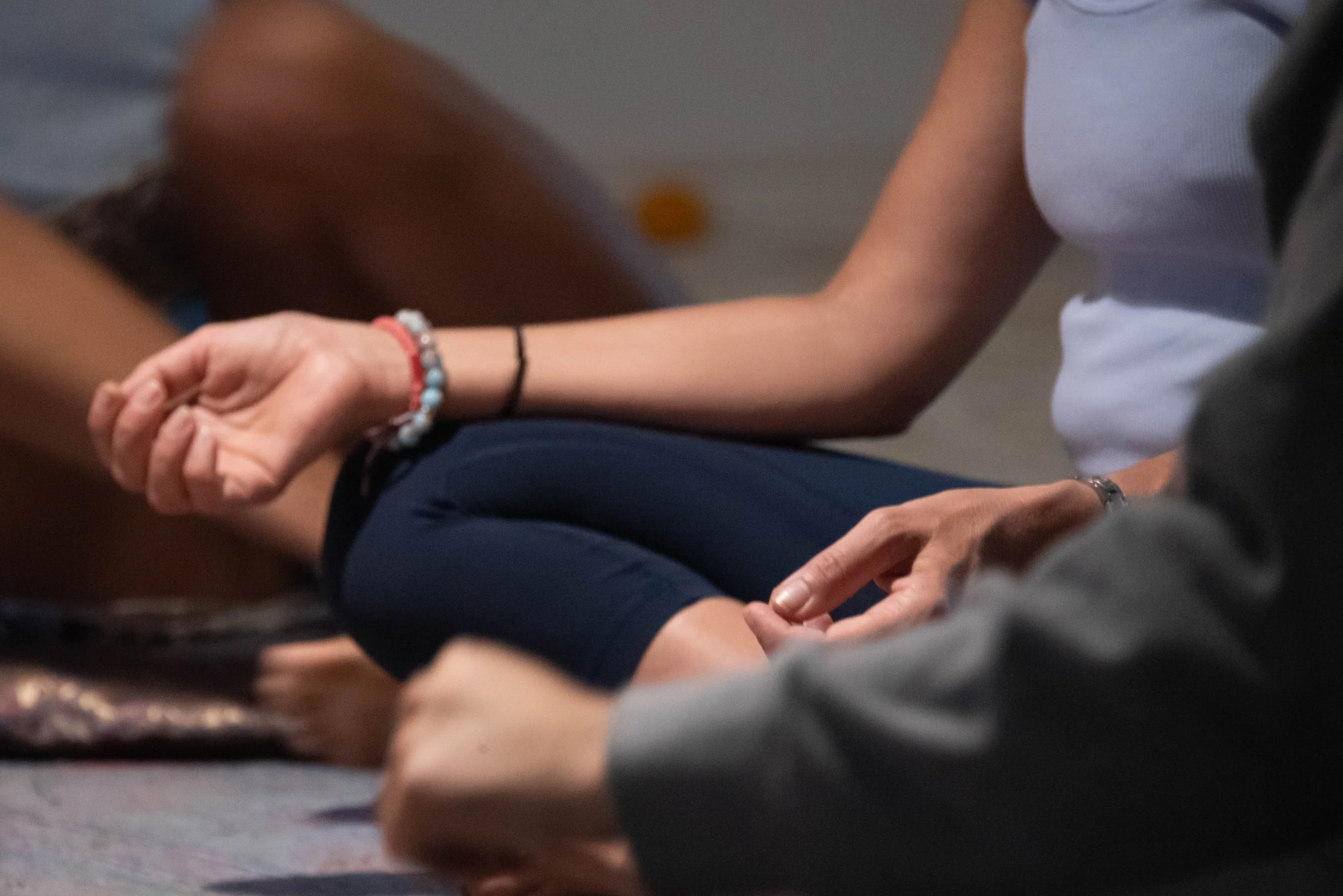 Close-up of a hand in meditation mudra representing the yamas, the first step in Yoga, at SKY Yoga and Meditation Bali