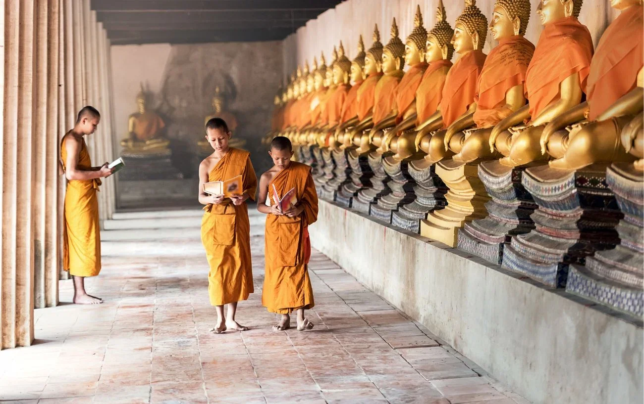 Monks engaged in quiet self-study and contemplation as part of a traditional Yogic practice