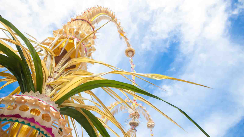 Traditional Balinese penjor decorations during Galungan near SKY Yoga and Meditation eco-village in Ubud, symbolising the harmony between Yoga, dharma, and daily life in Bali.