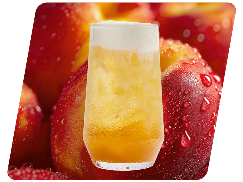 A glass of beer with foam on top, placed in front of a background of fresh strawberries with water droplets.