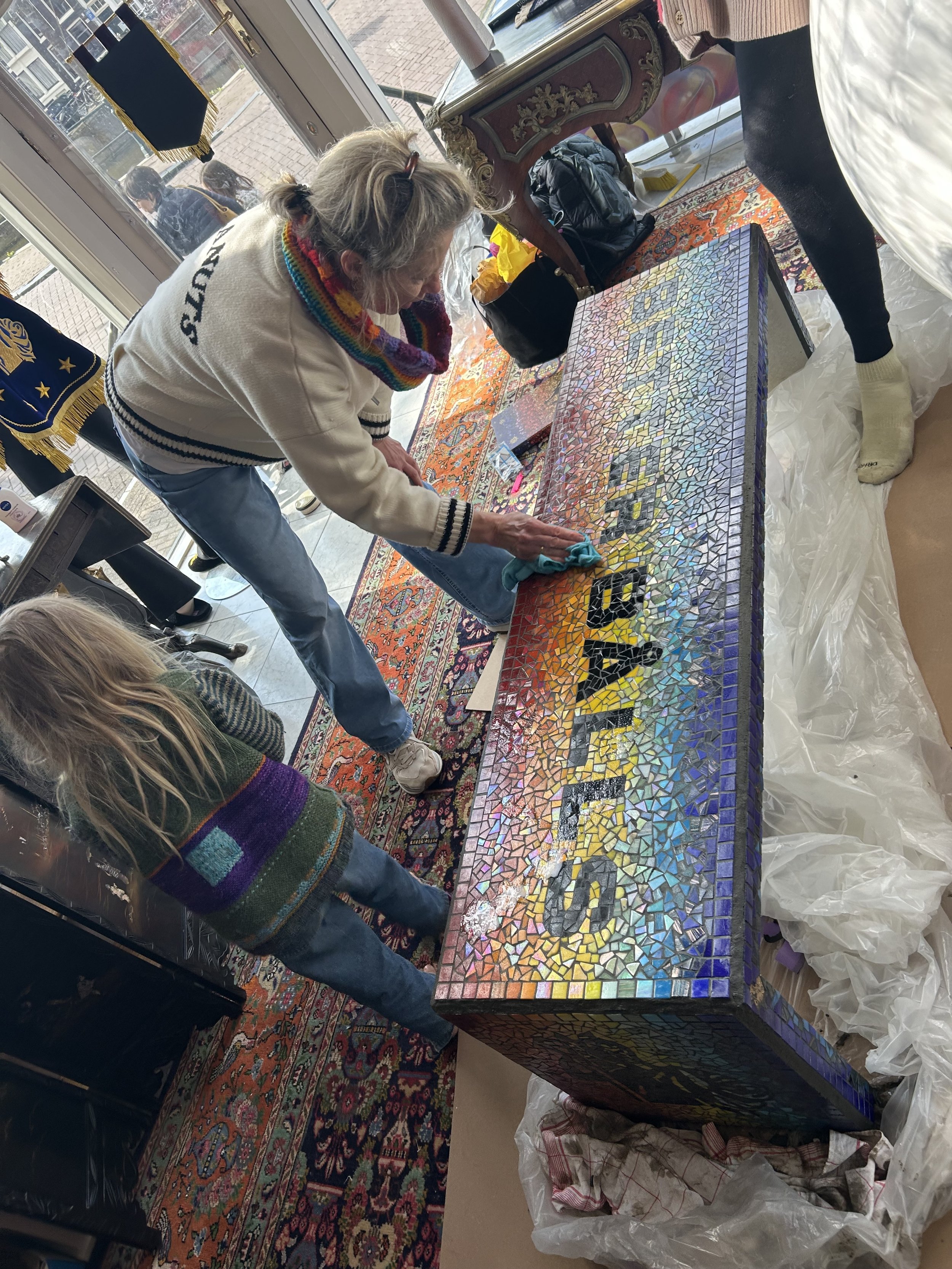 Mosaic Atelier Amsterdam Artist Susanne Blom working on BETTER BÅLLS Mosaic Bench at the Keizersgracht Showroom