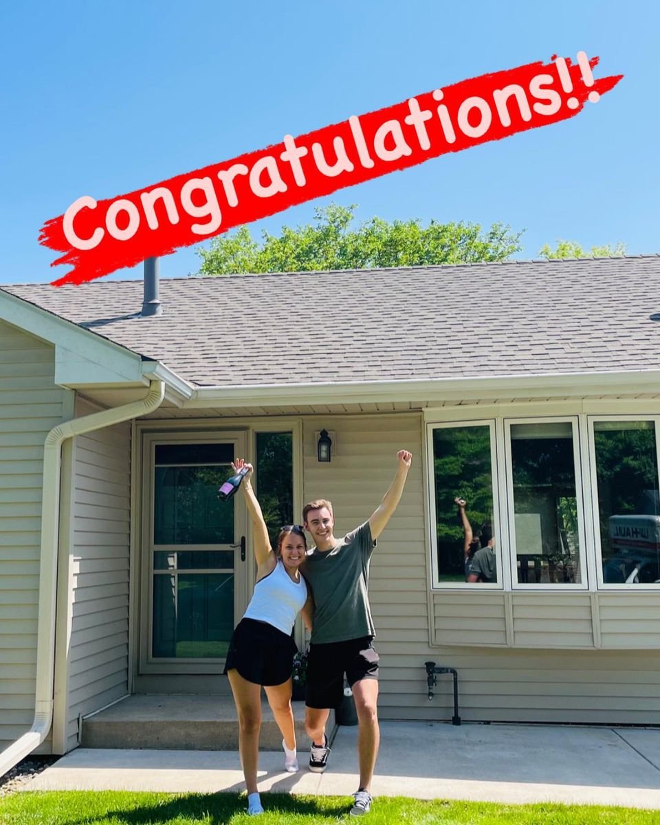 Two people celebrating outside a house with "Congratulations!!" text.