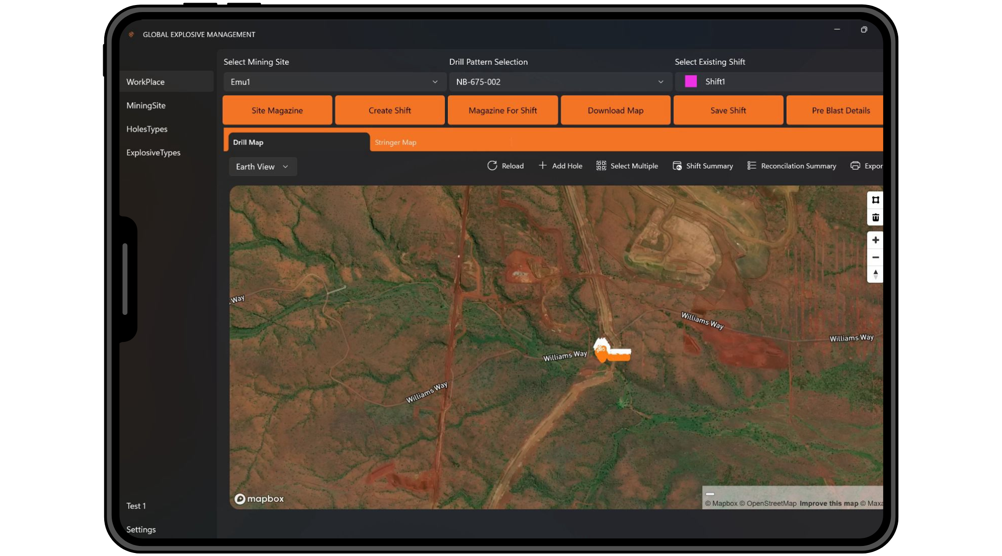 Screenshot of a tablet display showing a map interface with an aerial view of land, labeled 'Williams Way,' possibly indicating a mining site or construction area, with various map controls and menu options on the screen.