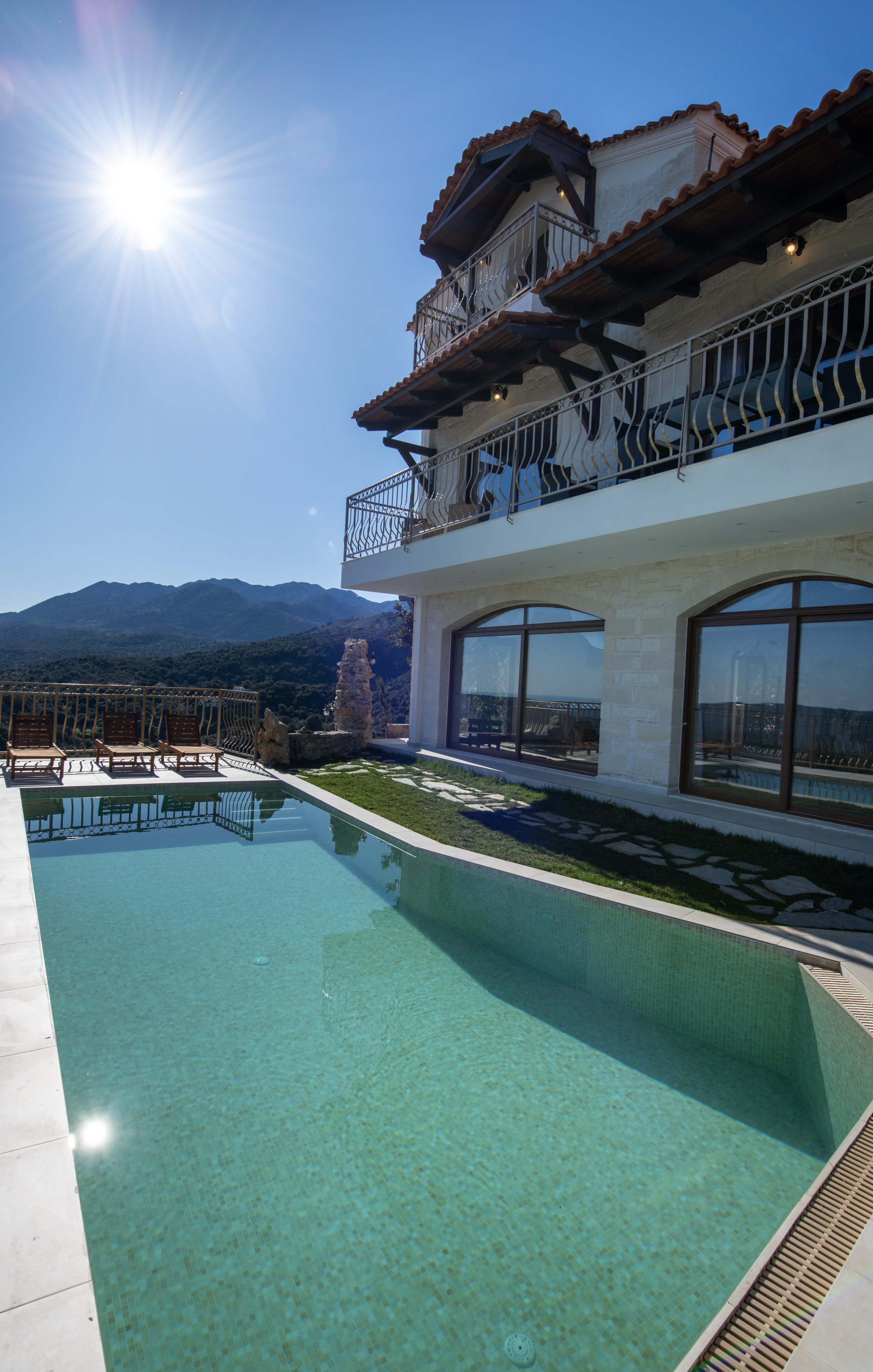 Luxury villa with a swimming pool, mountain view, sunny weather