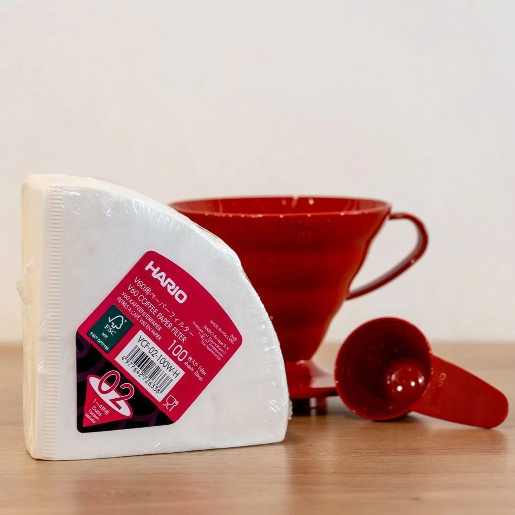 Red Hario V60 (02) and filters on counter