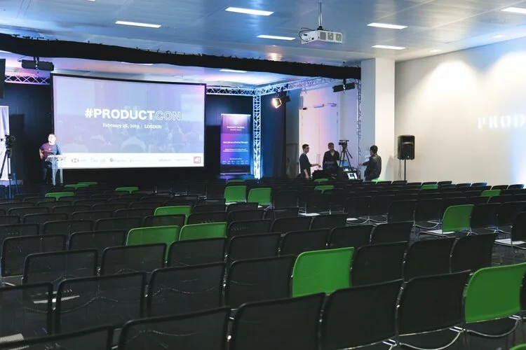 AV technicians at event with cameras, speakers and a hired projector