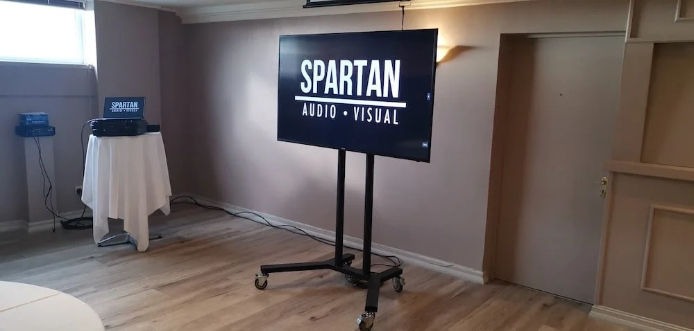 Hire Equipment for Meeting Rooms Near Me. Spartan Audio Visual supplies a Screen and Laptop for Meeting in Cardiff.