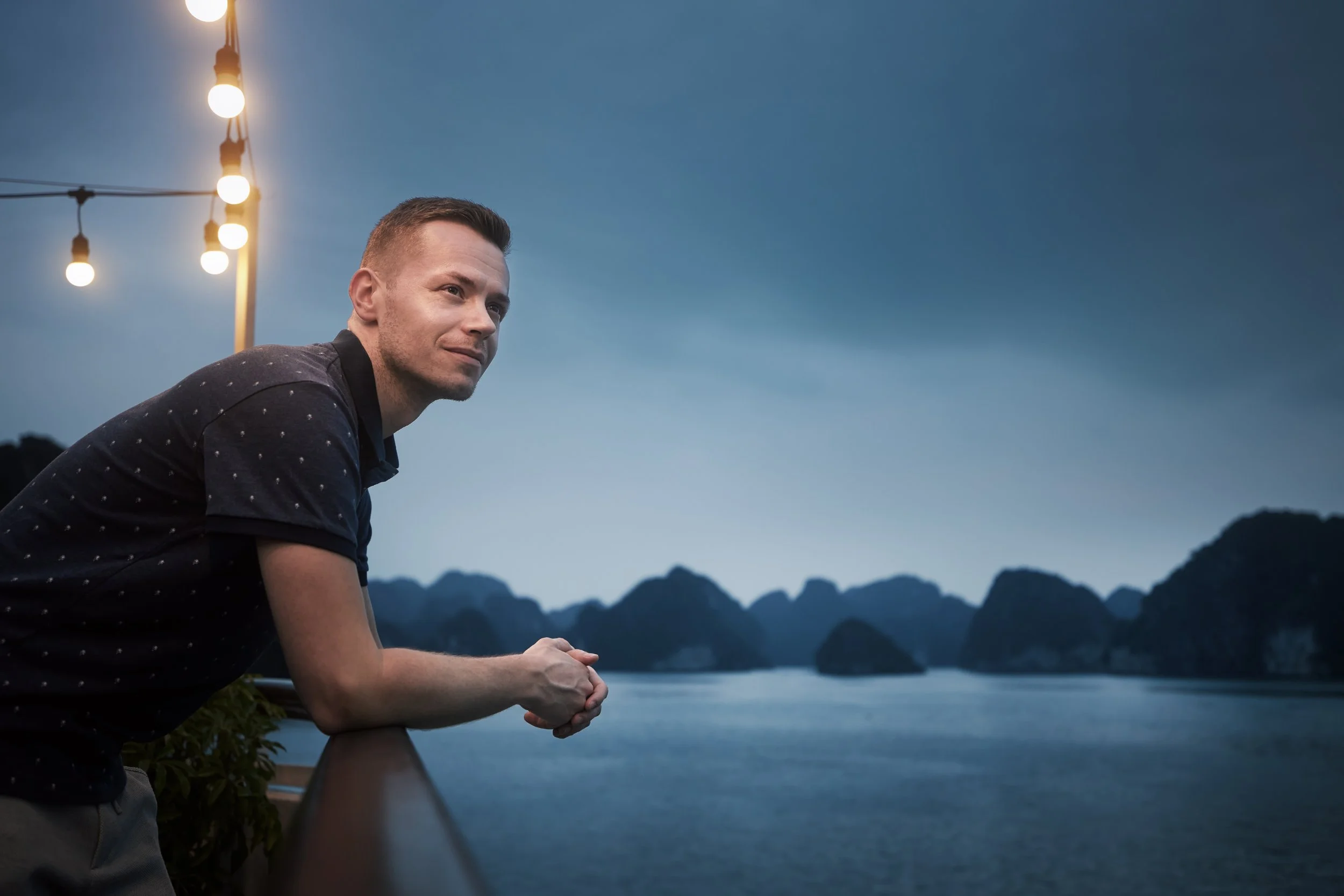 man-enjoying-night-view-from-cruise-ship-between-i-2026-03-18-20-47-43-utc.jpg