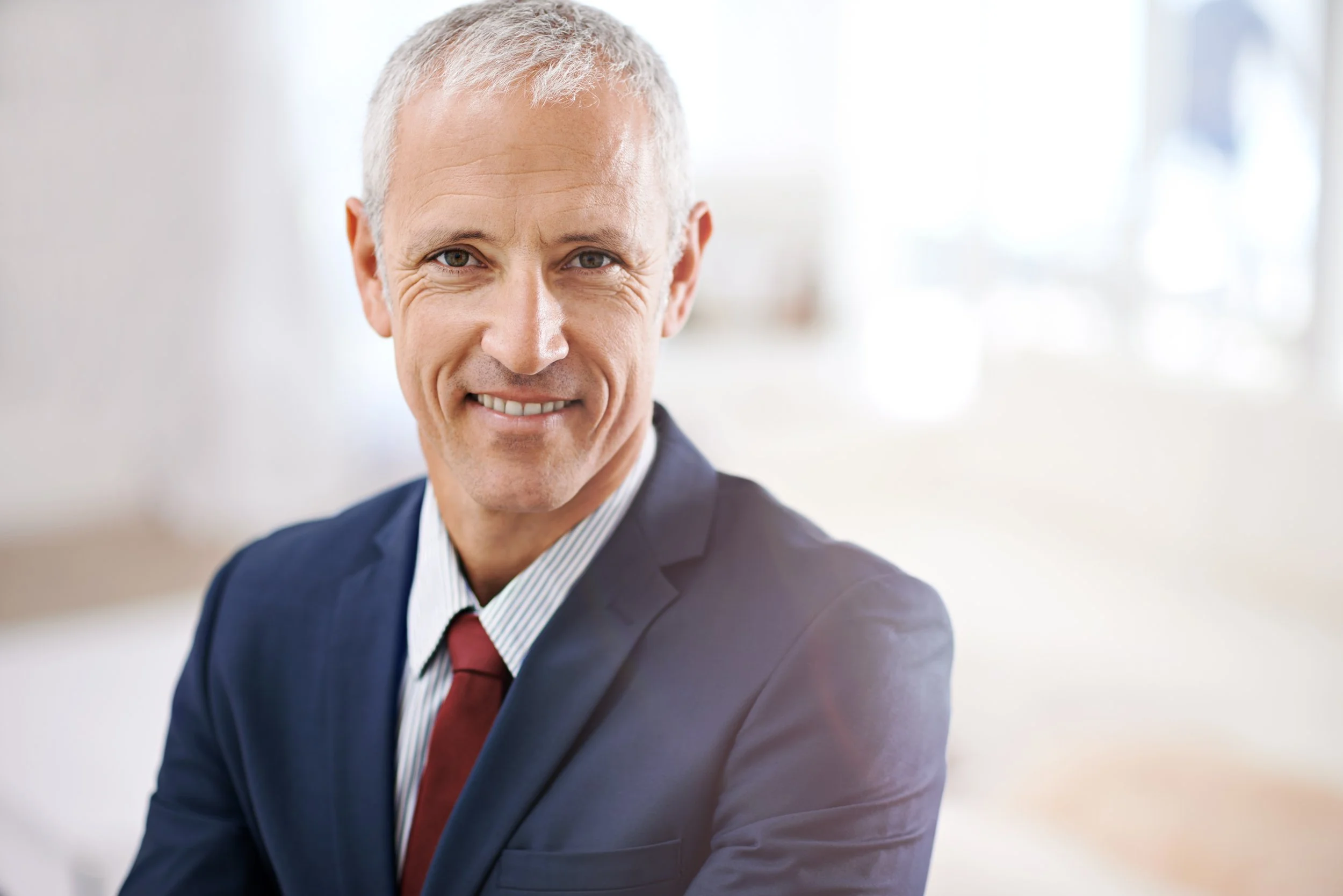 confident-businessman-smiles-wearing-suit-and-tie-2026-03-25-06-07-09-utc.jpg