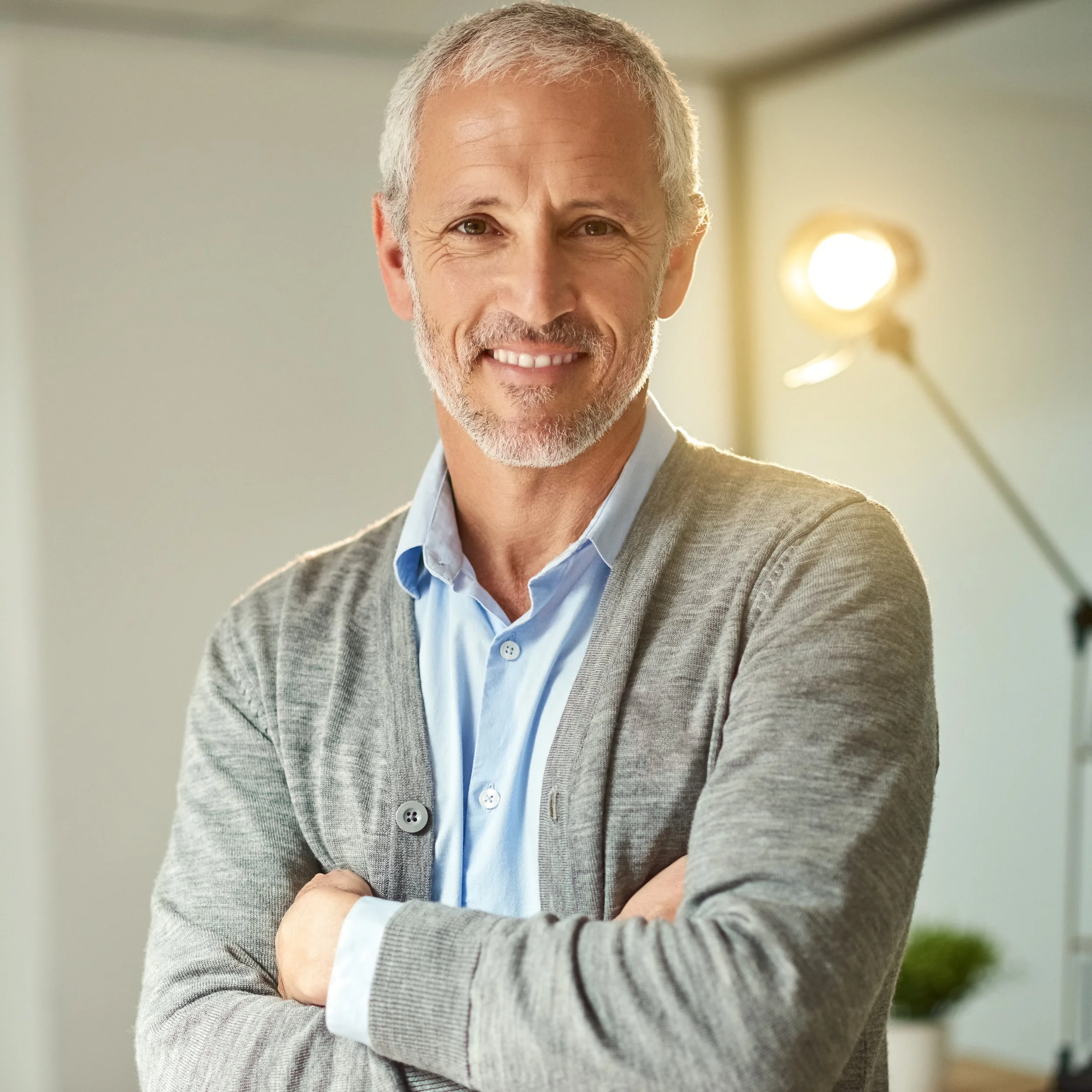 mature-man-smiles-confidently-with-arms-crossed-2026-03-25-06-09-31-utc.jpg