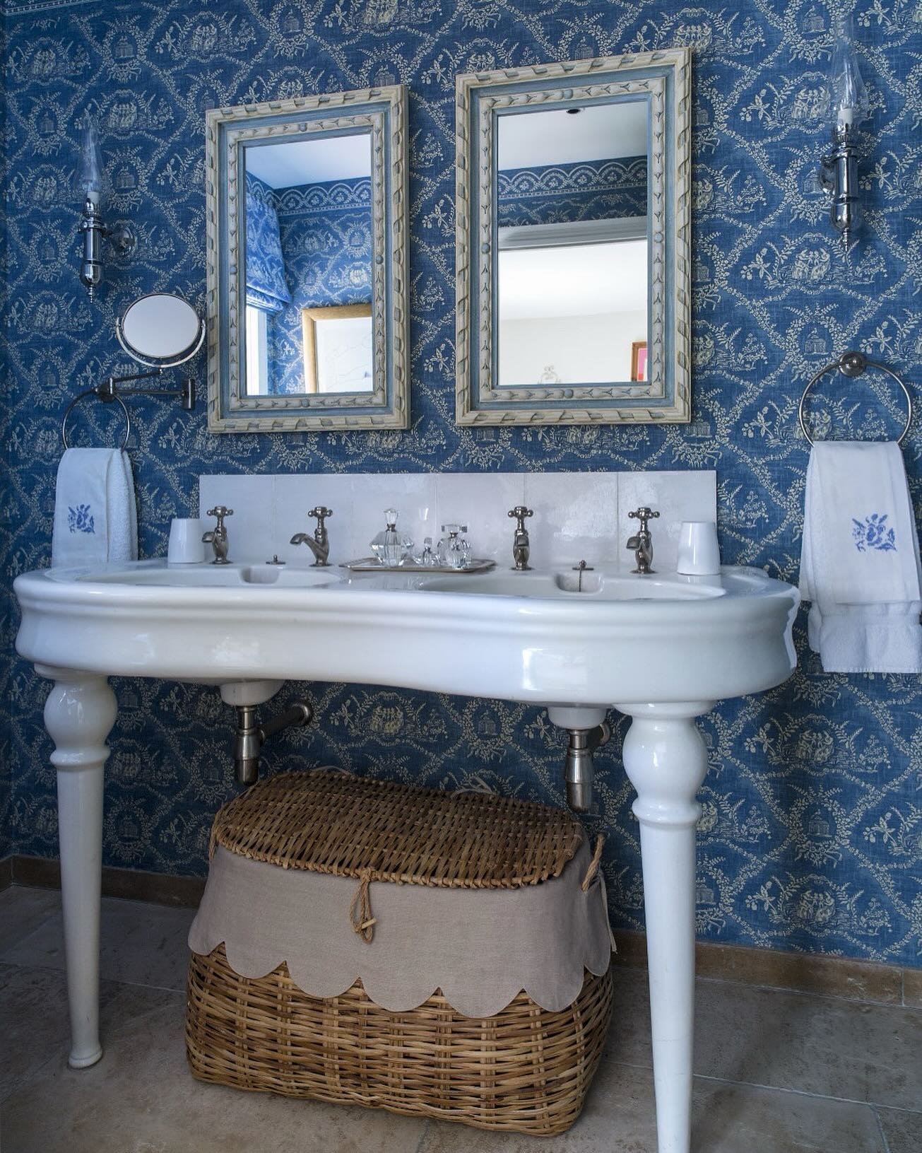 The prettiest blue bathroom in our South of France project. We love the wicker basket sourced in St Tropez market and the two antique mirrors give the space such character. 

Wallpaper is archived @lamaisonpierrefrey 
Shot for @englishhomemag