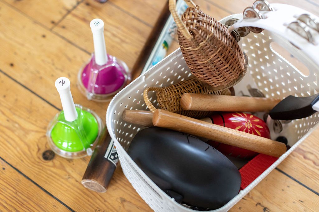 Percussion instruments in a plastic basket