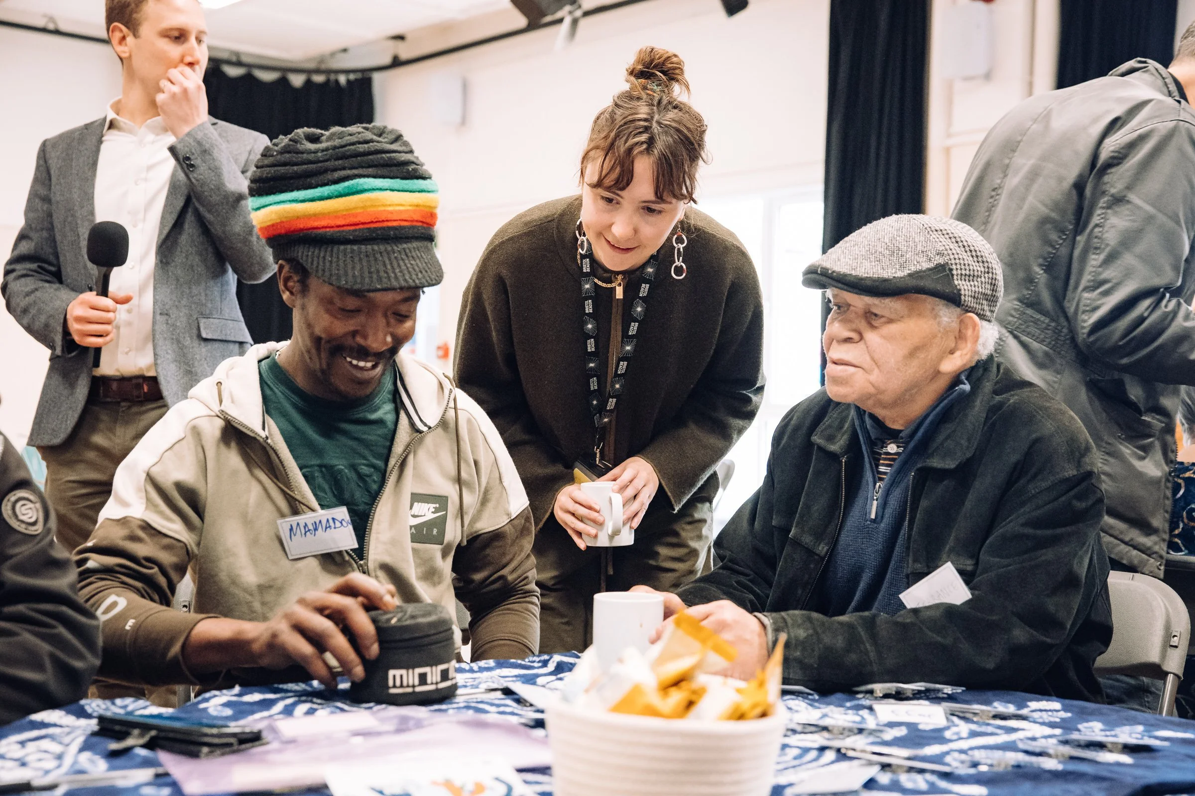People sitting at a table and smiling