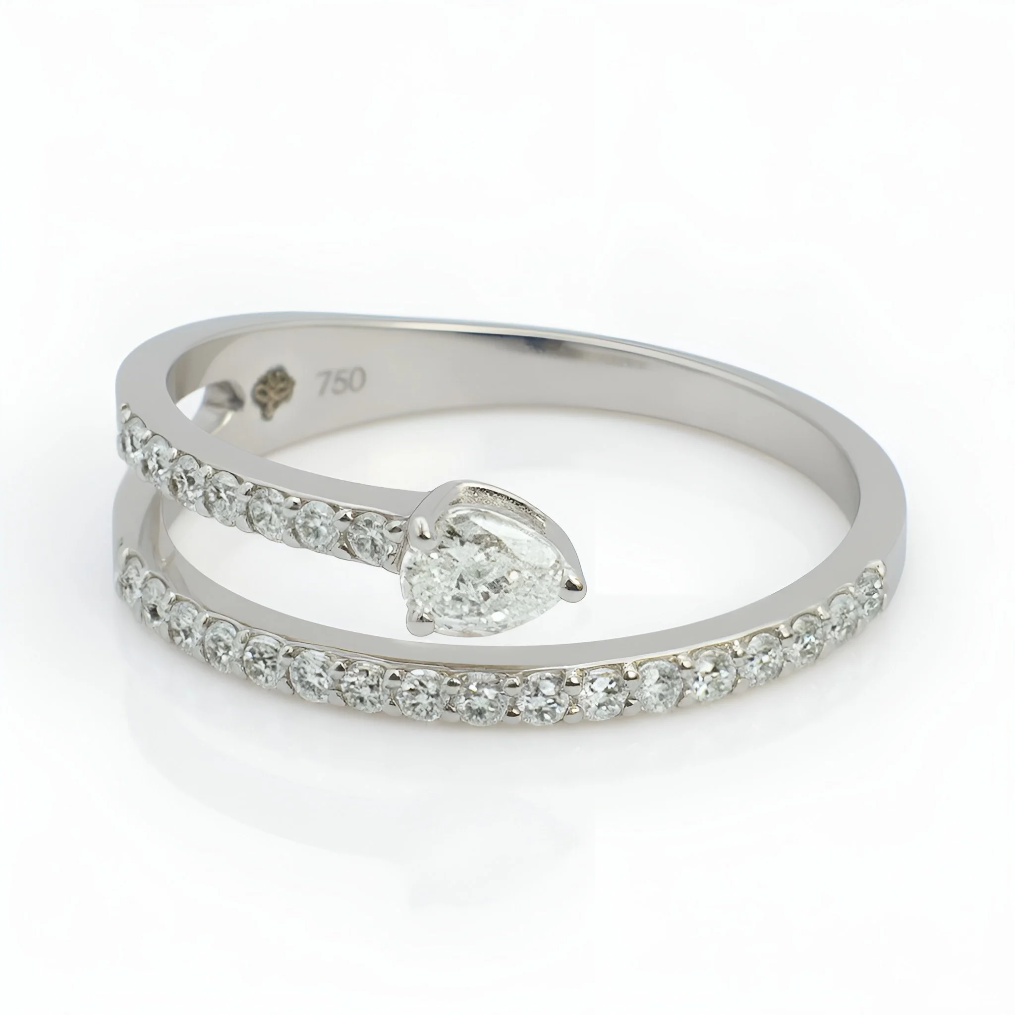 A silver ring with a heart-shaped diamond and a row of smaller diamonds on either side, engraved with 750 inside.