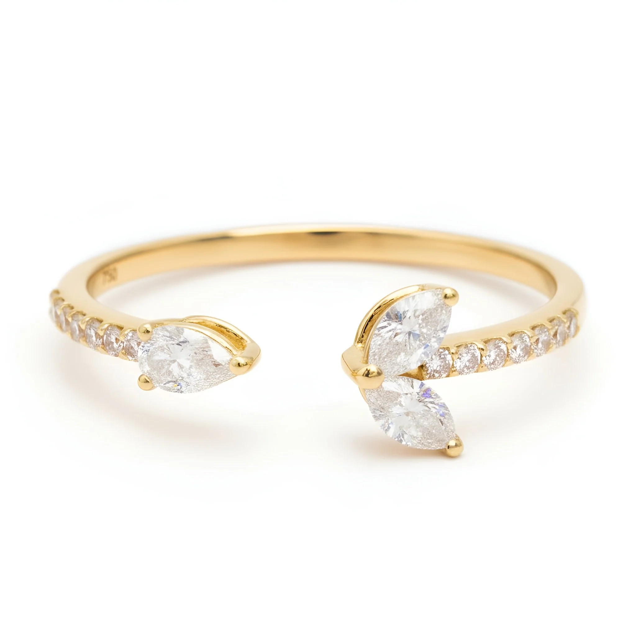 Gold open ring with large heart-shaped diamonds at each end and smaller diamonds along the band.