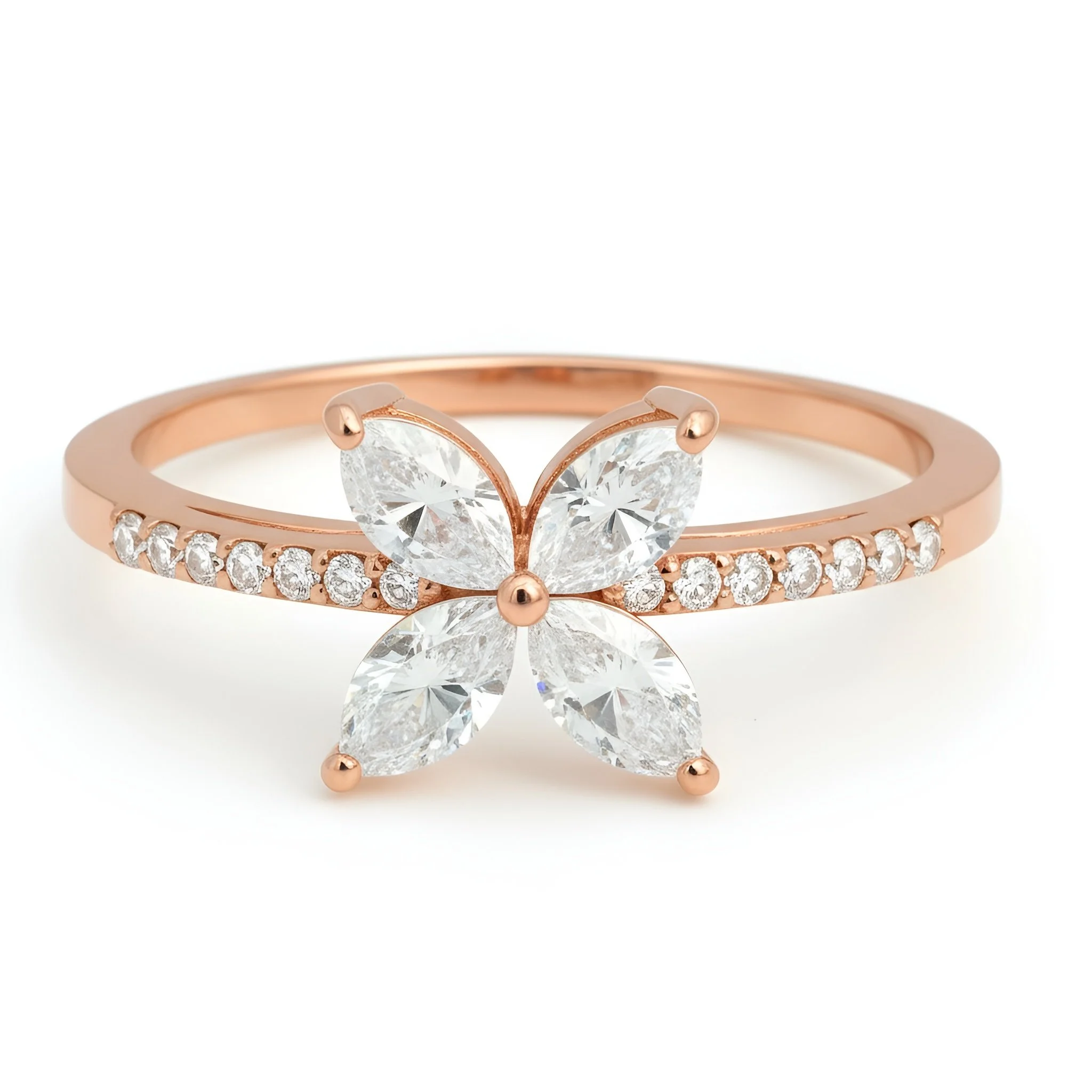 Rose gold ring with a butterfly-shaped design featuring four large diamonds and a band adorned with small diamonds.
