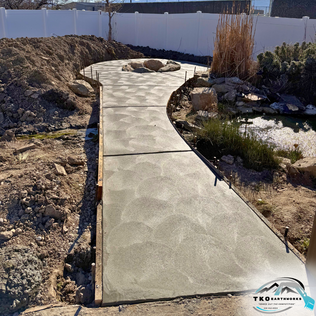 Pouring concrete for a custom pathway to a Fire Pit