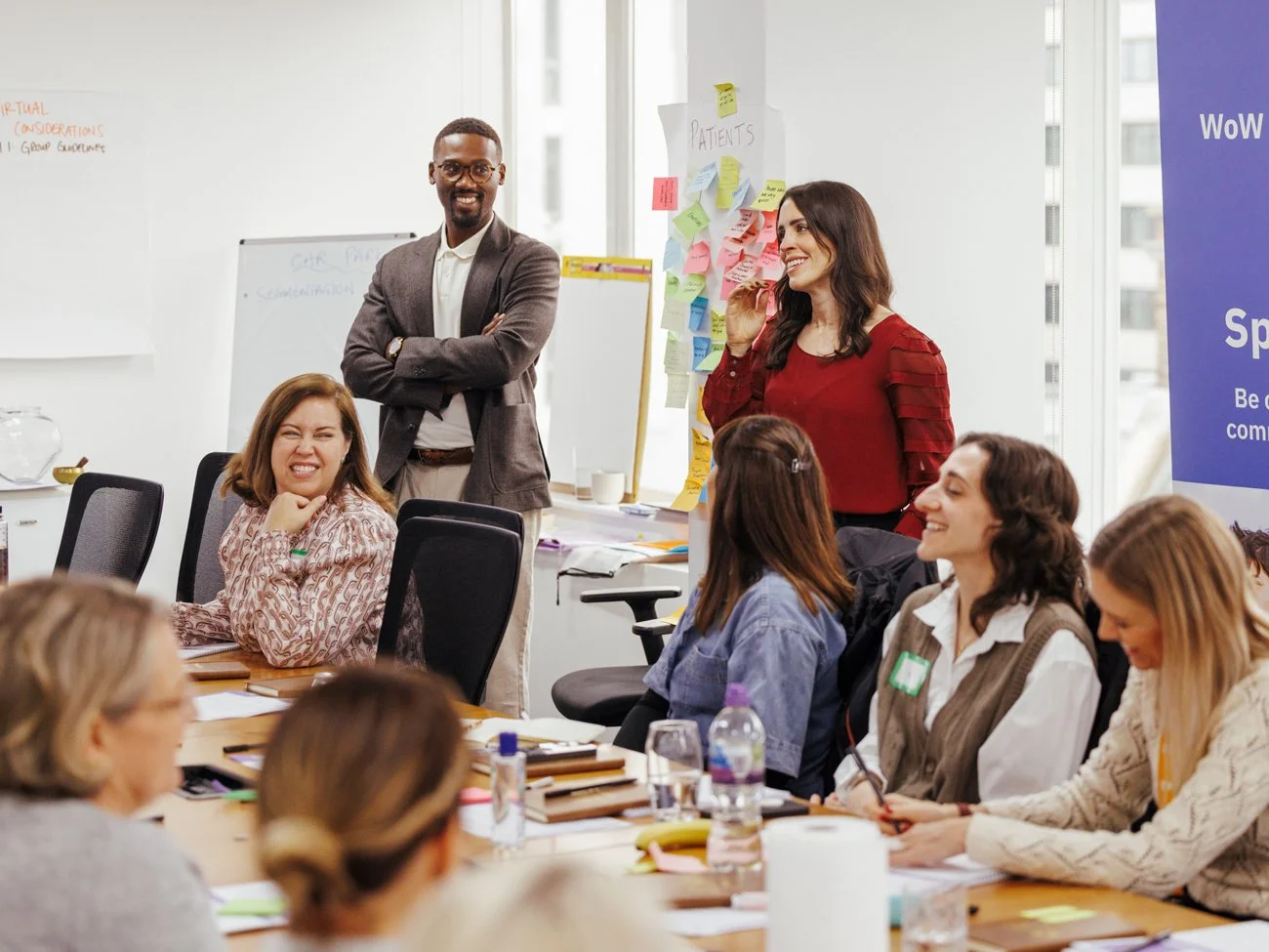 An organizational development team who is smiling and working with an organization looking for growth