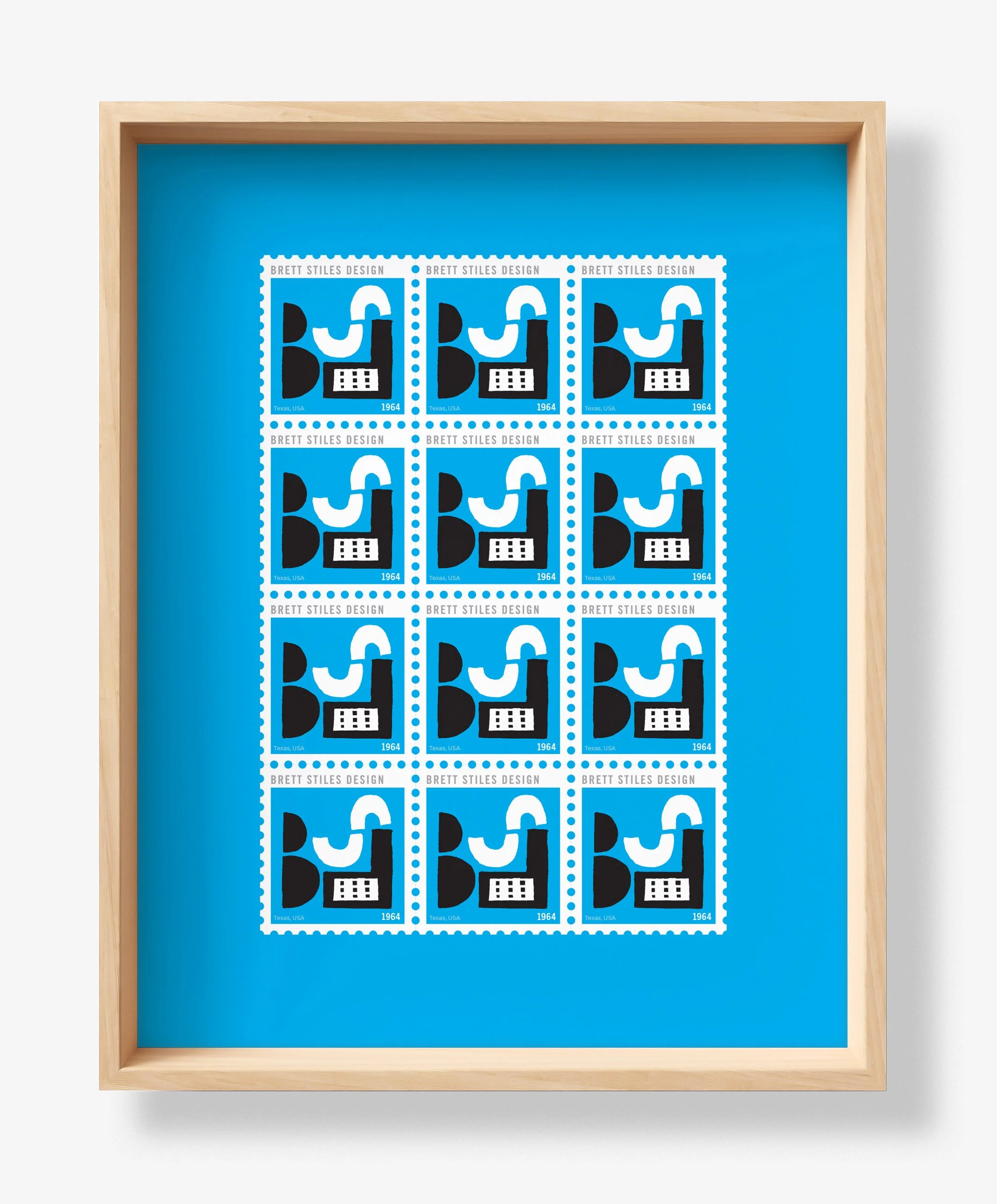 A framed sheet of twelve postage stamps with abstract blue, black, and white design elements, labeled 'Brett Stiles Design,' from Texas, USA, dated 1964.