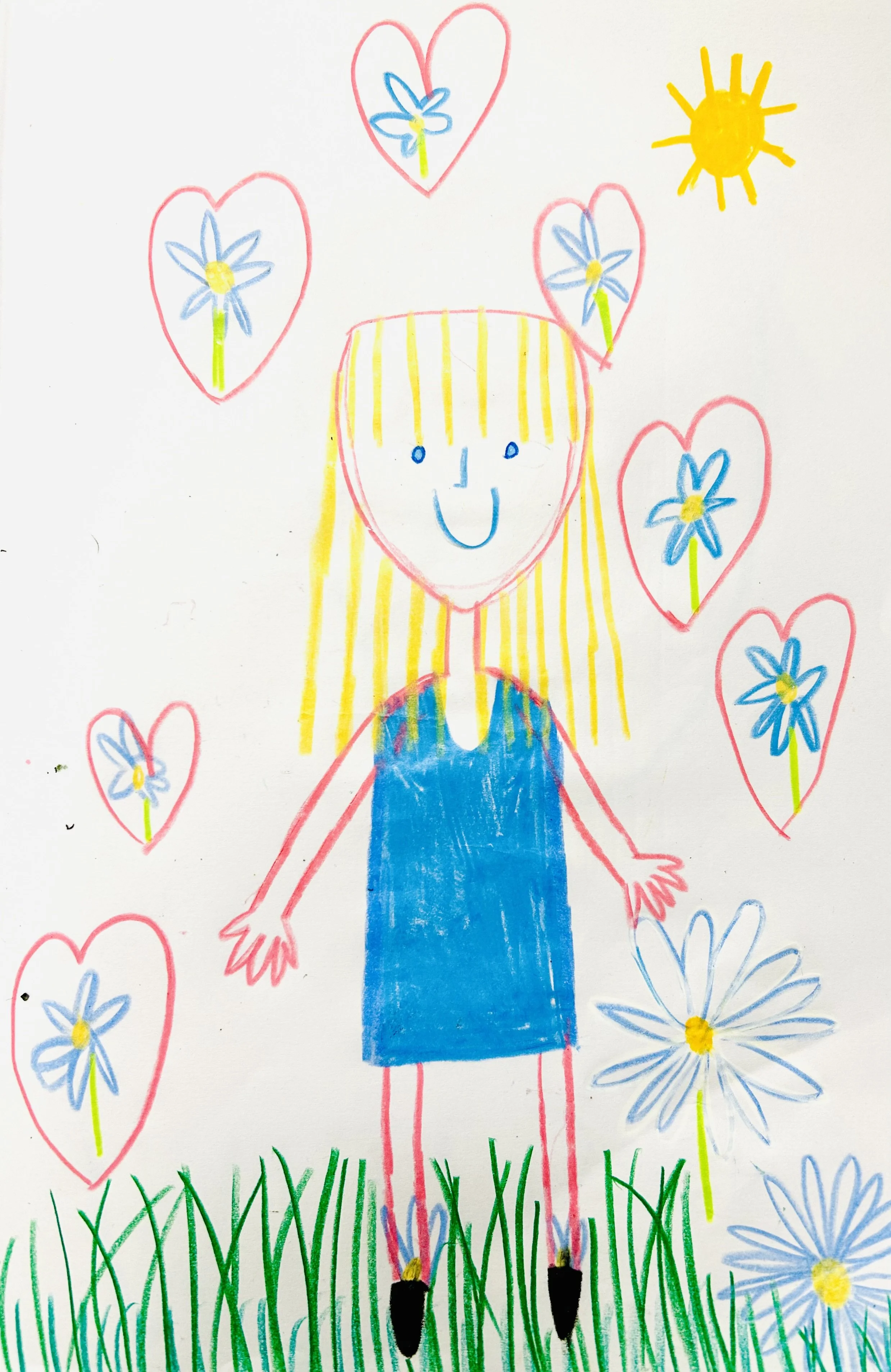 Child's colorful drawing of a girl with yellow hair, wearing a blue dress, standing in green grass, surrounded by blue flowers and red hearts, with a yellow sun in the sky.