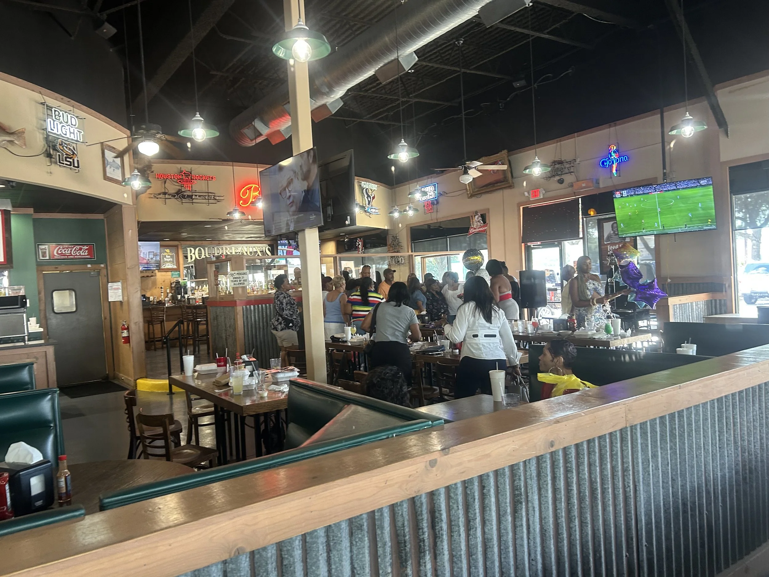Inside Boudreaux's Cajun Kitchen at Willowbrook, showing the bar and pool table area