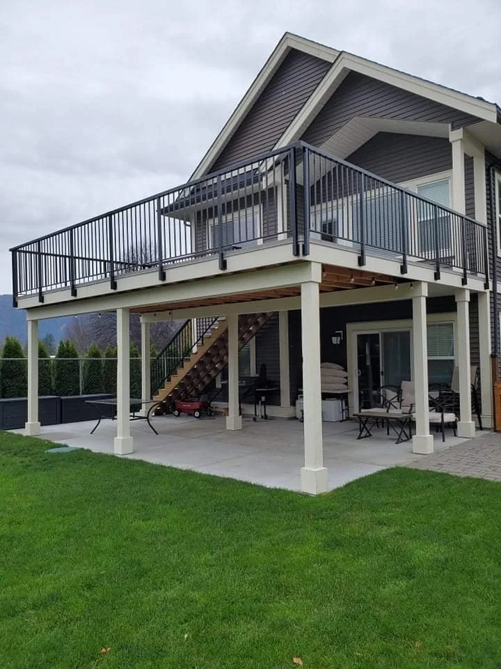 back deck over covered patio with stairs connecting