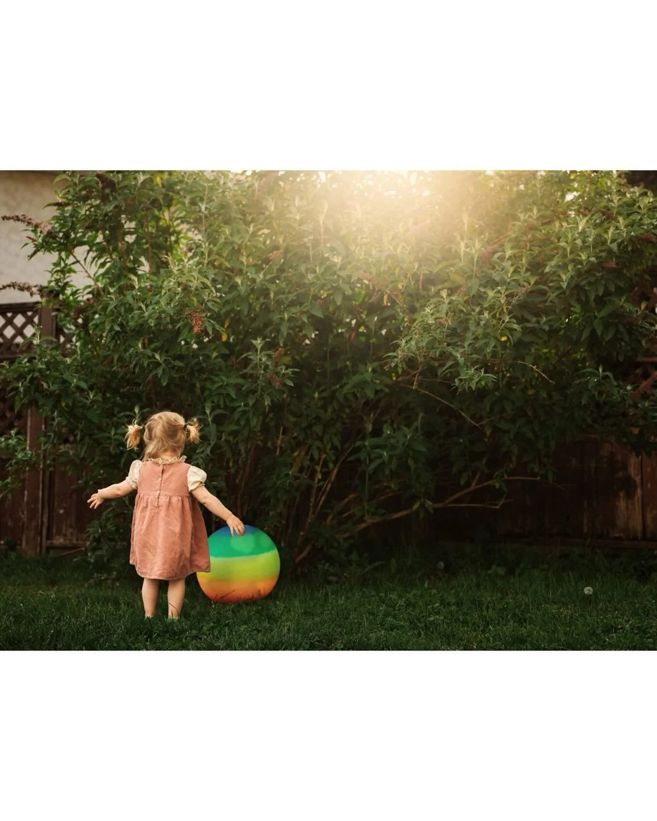 Throwback to spring evenings in the front yard at sunset. Bare feet, warm light and a rainbow ball. The simple joys. 
.
.
.
#nikonphotographer #clickcommunity #familymoments #toddlerlife