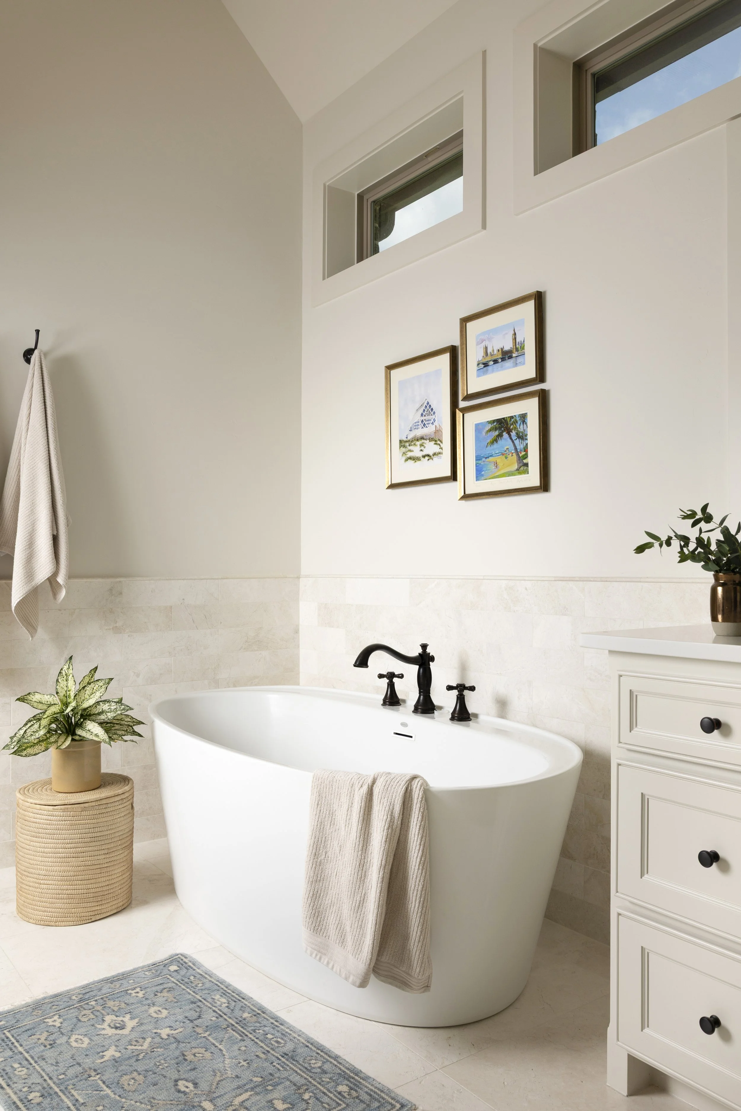 Clean lines, thoughtful storage, and timeless materials bring everyday luxury to this Dallas-Fort Worth area primary bathroom.