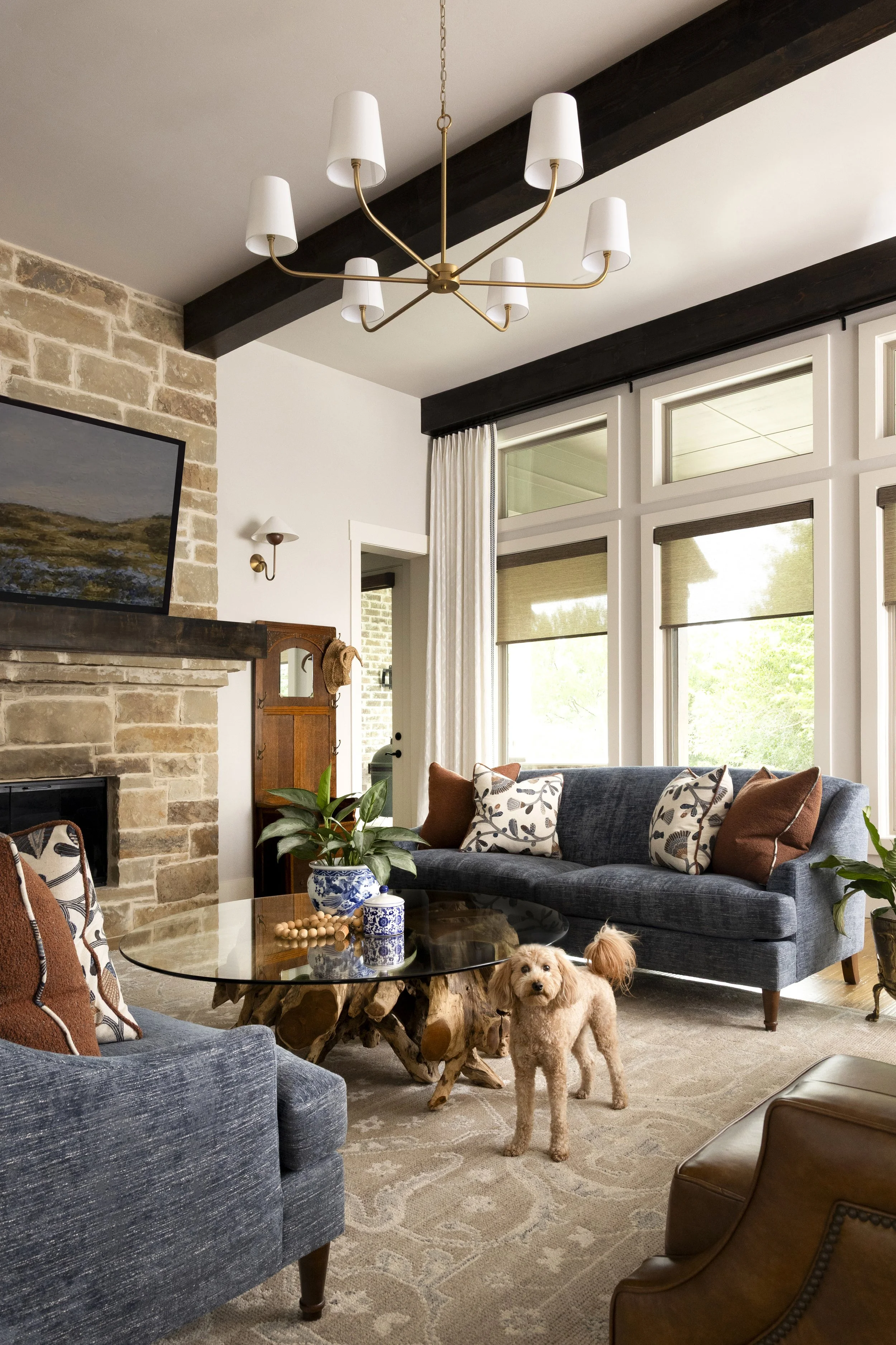 Warm textures, timeless furnishings, and thoughtful layering create a welcoming living space in a Dallas-Fort Worth area home.