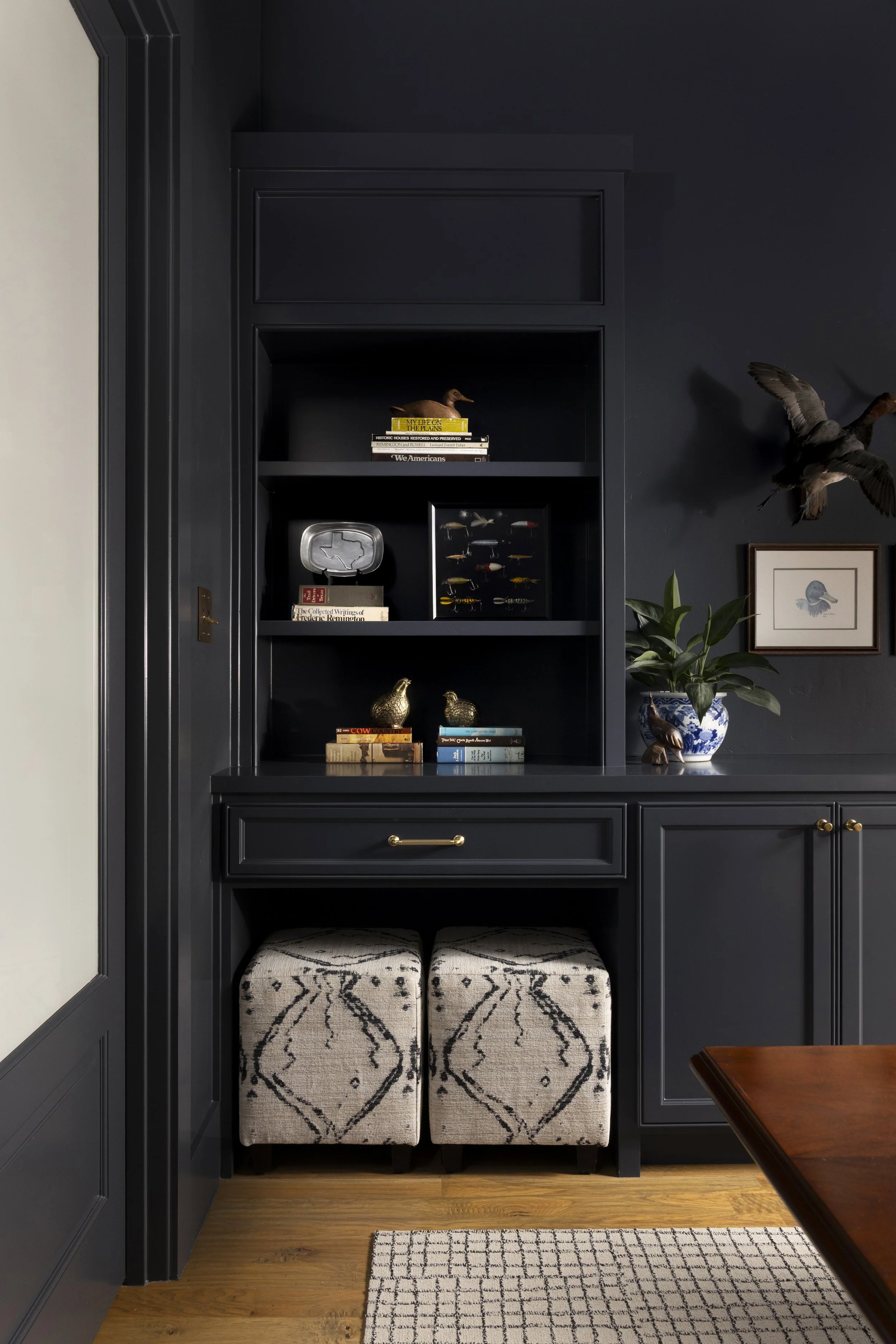 Thoughtfully styled shelving and custom cabinetry bring personality and function to this Dallas-Fort Worth area home office.
