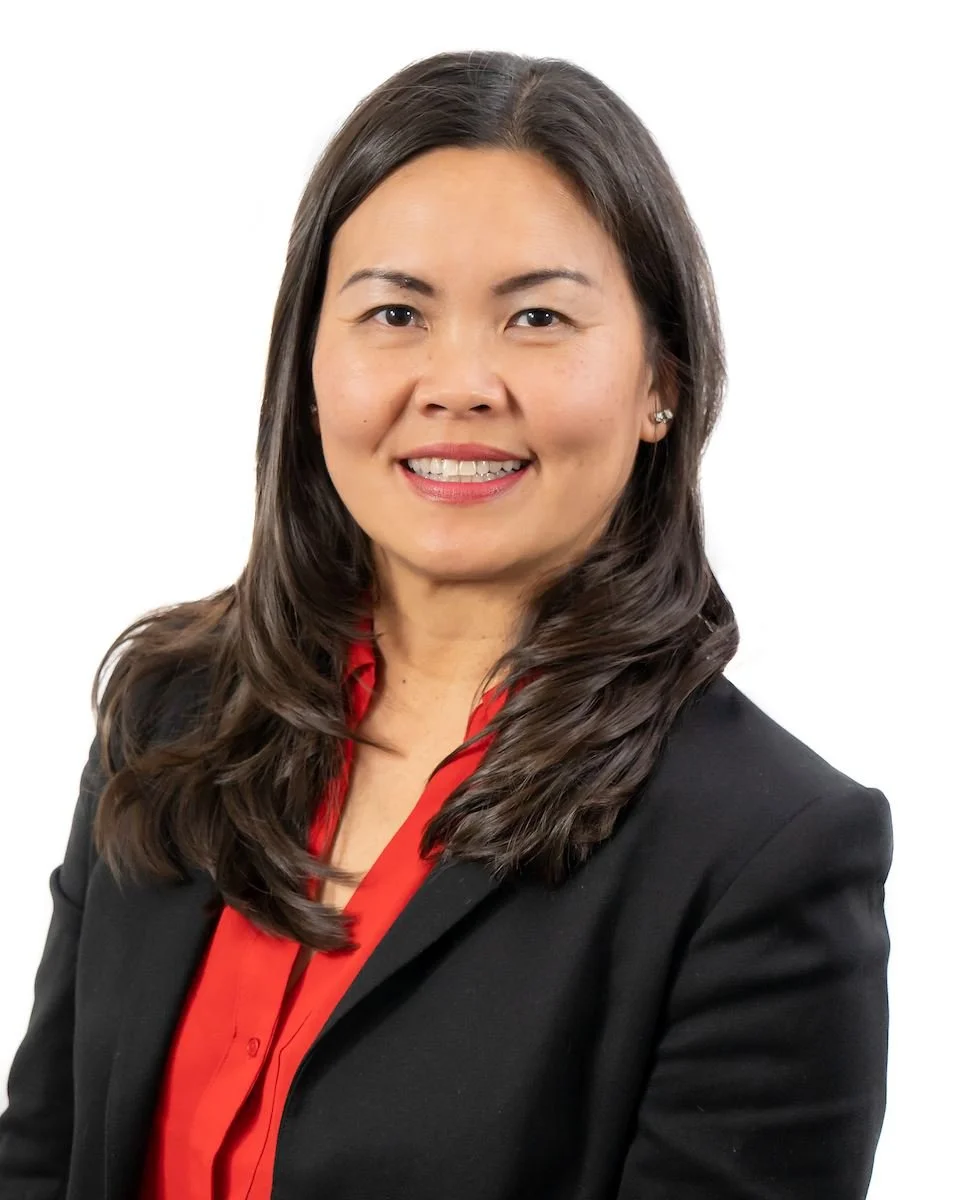 Fountain Valley City Manager Maggie Le smiling on a white background