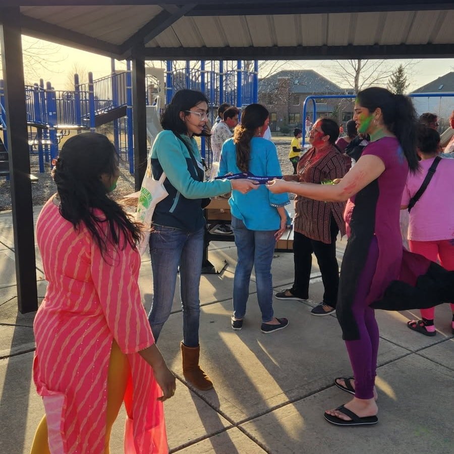 While canvassing yesterday, I happened to come across a neighborhood #Holi celebration at Cedar Creek Park! I had a great time talking with our neighbors about my candidacy for the park district, and even managed to get a little color on myself!
It