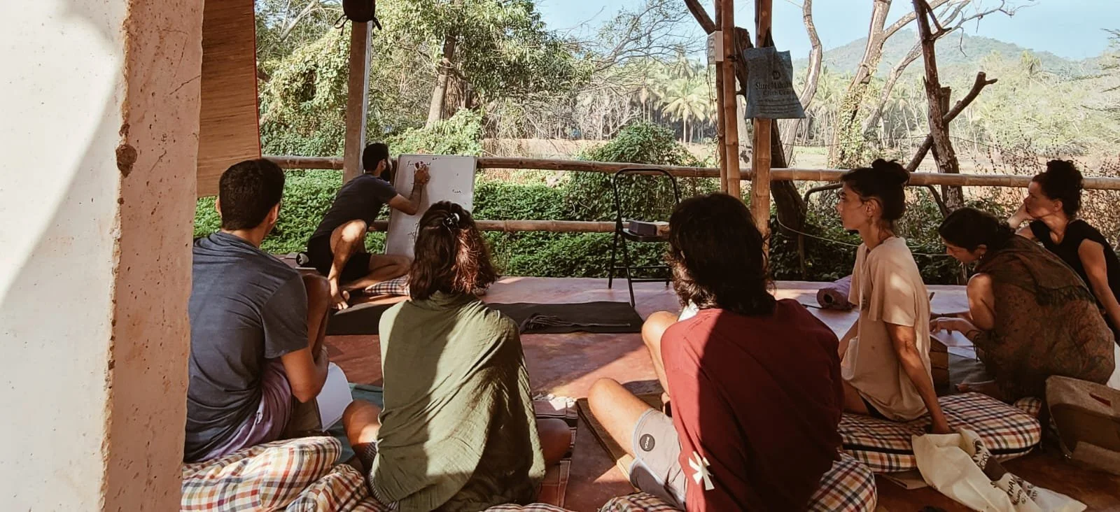 200-hour yoga teacher training students practicing Hatha yoga outdoors in Palolem, South Goa