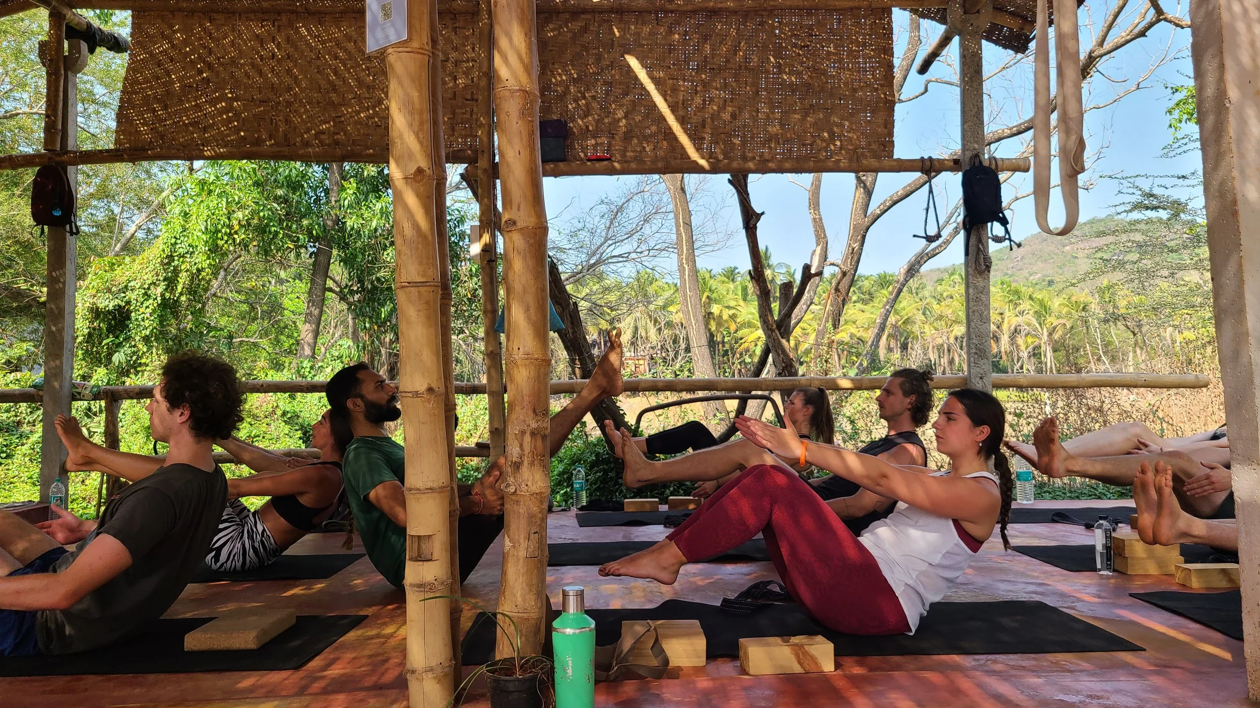 Yoga teacher training students studying anatomy and yoga philosophy at Yoga Alliance certified school in Goa