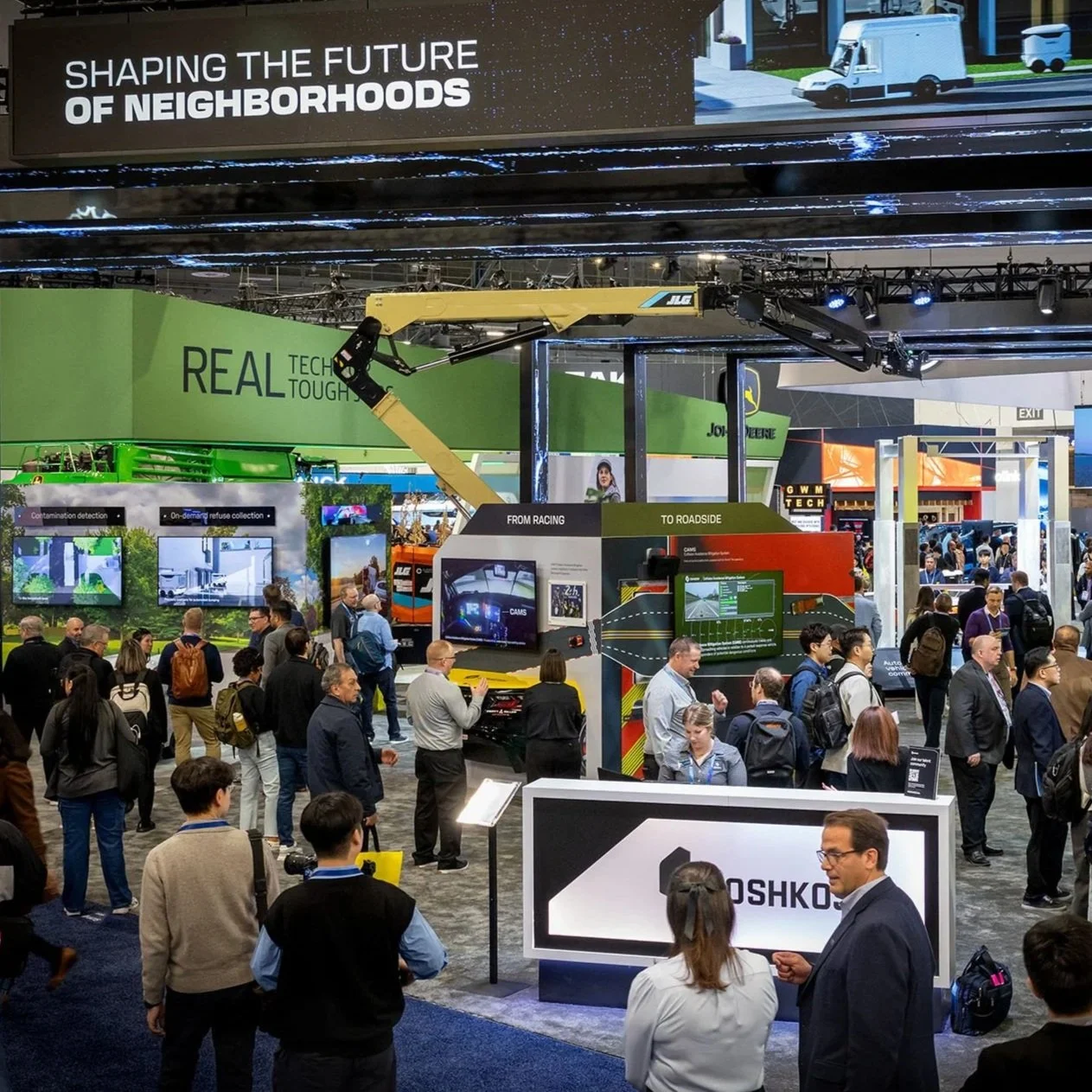 Corporate event photography at CES Las Vegas OshKosh booth by Exceed Photography