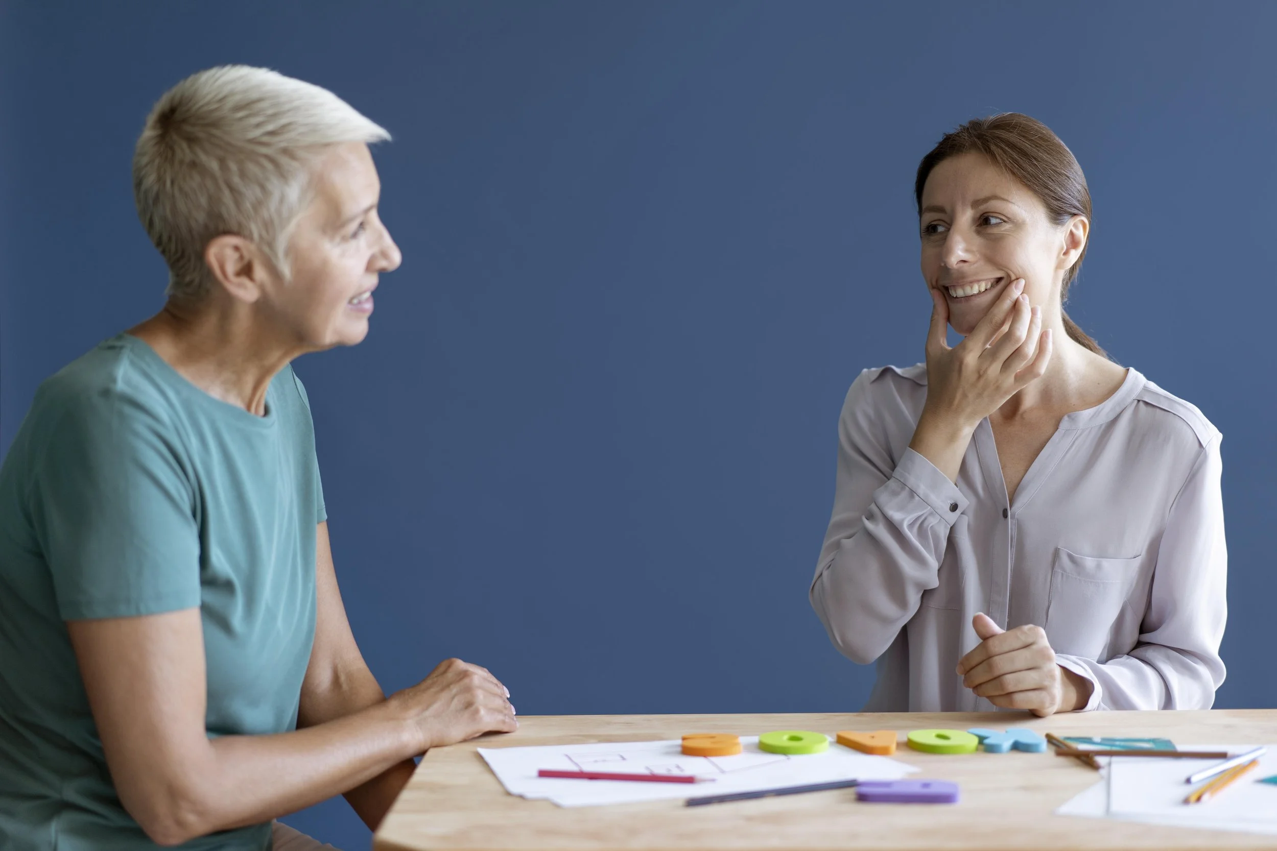 mature-woman-doing-occupational-therapy-session-with-psychologist.jpg