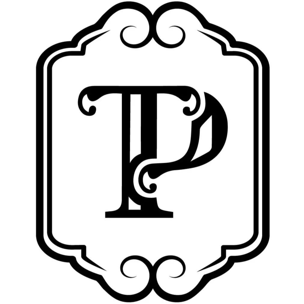 Black and white ornate frame with a decorative initial letter P in the center.