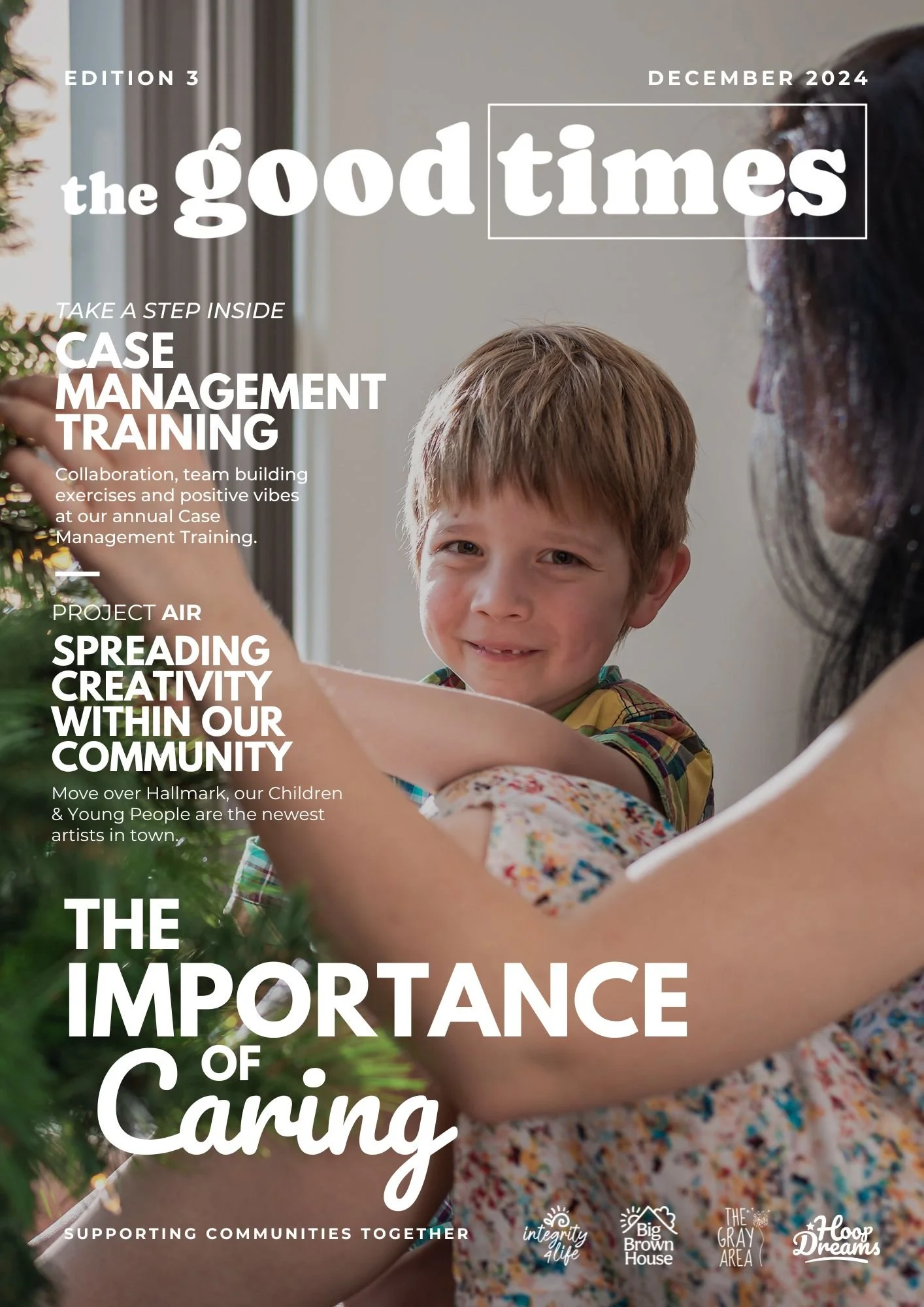 Magazine cover titled 'the good times' for December 2024, edition 3, featuring a woman and a young boy smiling and embracing near a Christmas tree.