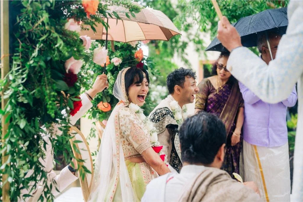 Bride and groom smiling together at the altar during their wedding ceremony