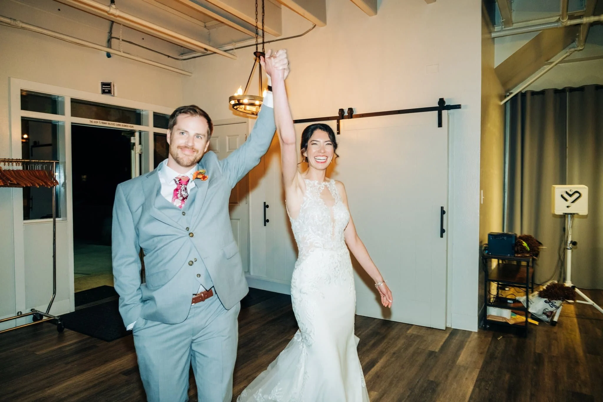 Bride and groom making their reception entrance at Maverick’s Beach House wedding in Half Moon Bay