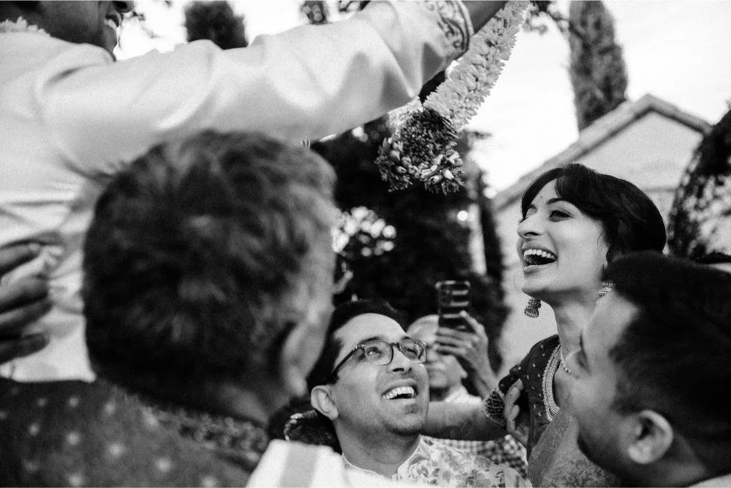 Bride smiling with wedding guests during the celebration