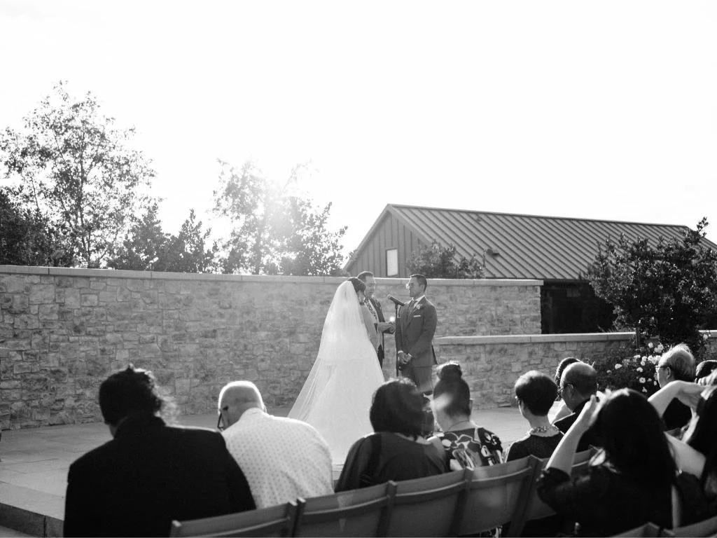 Bride and groom standing together at the altar during their ceremony