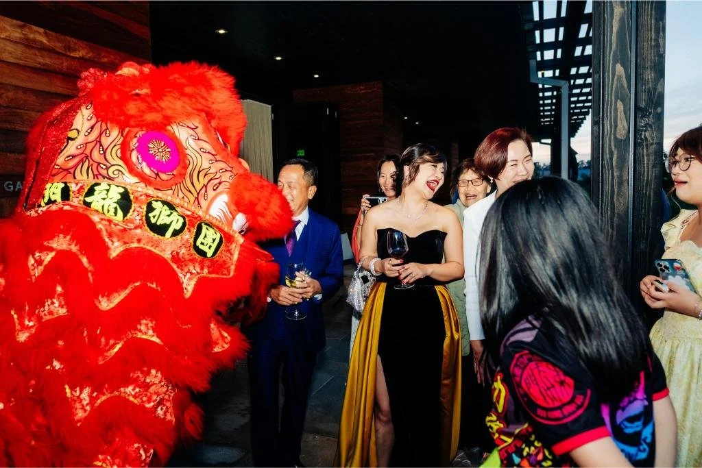 Red lion dance performer entertaining guests during the wedding reception